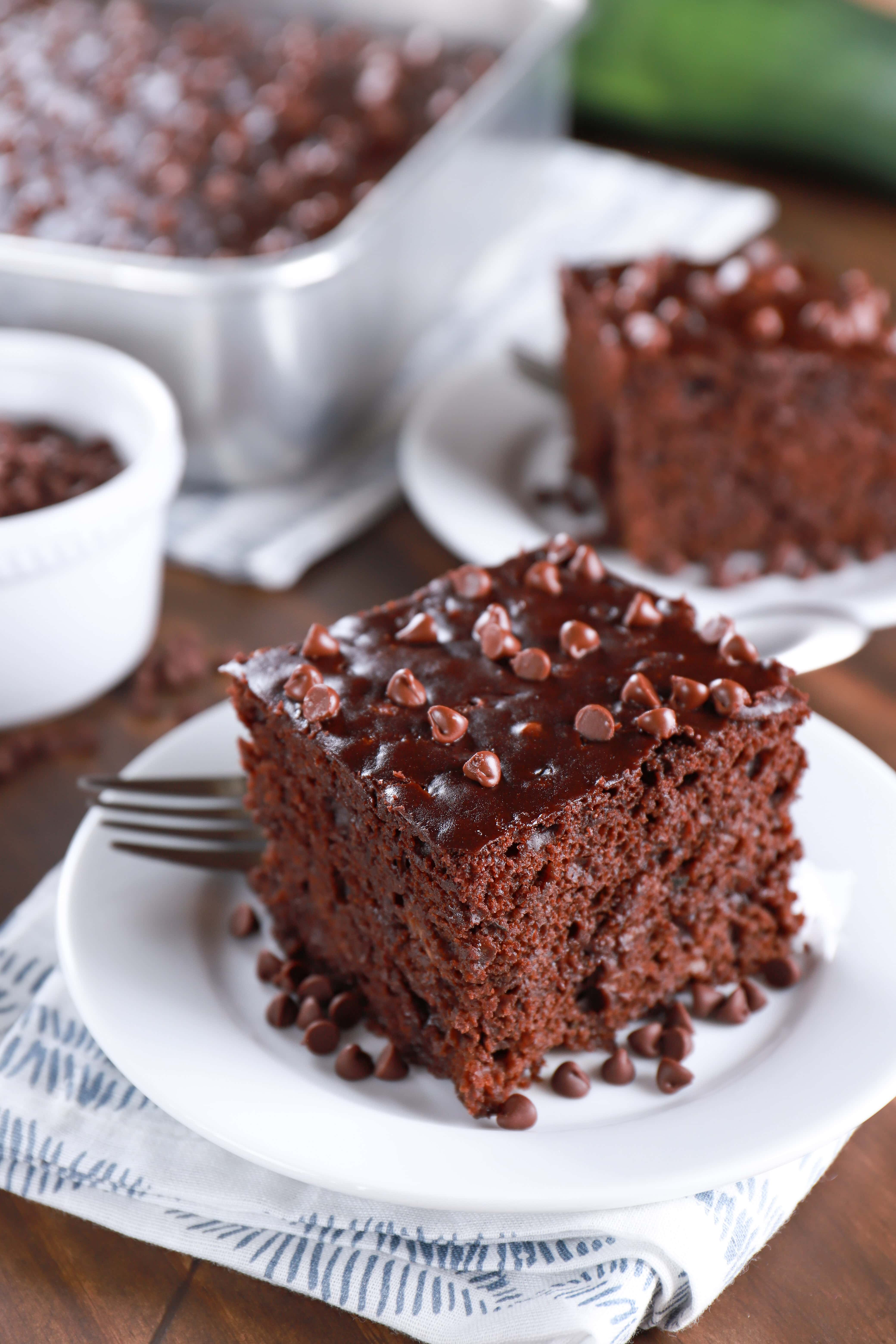 Plates of easy chocolate zucchini cake. Recipe from A Kitchen Addiction