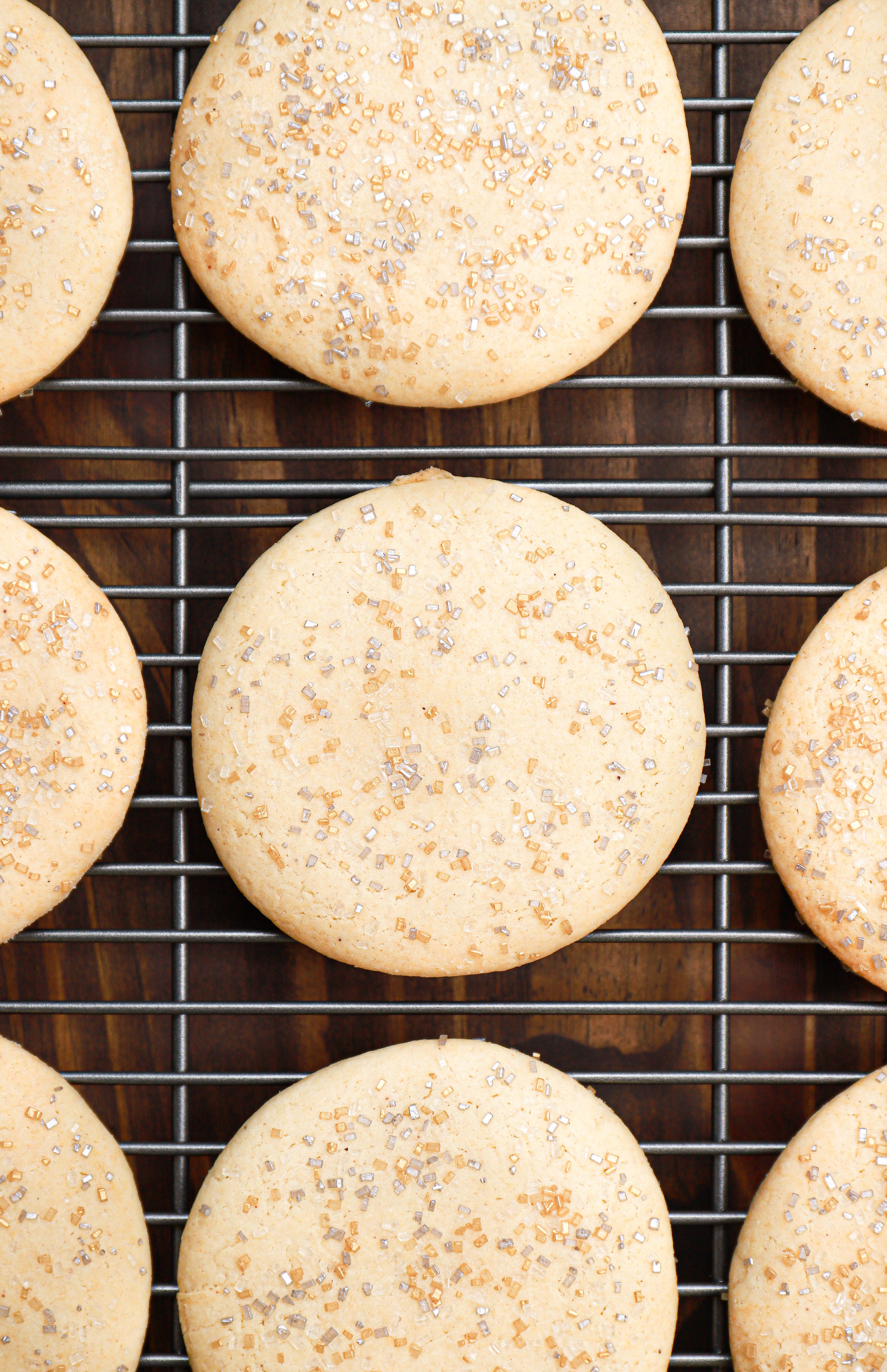 Overhead view of classic sour cream cookies on a wire cooling rack.