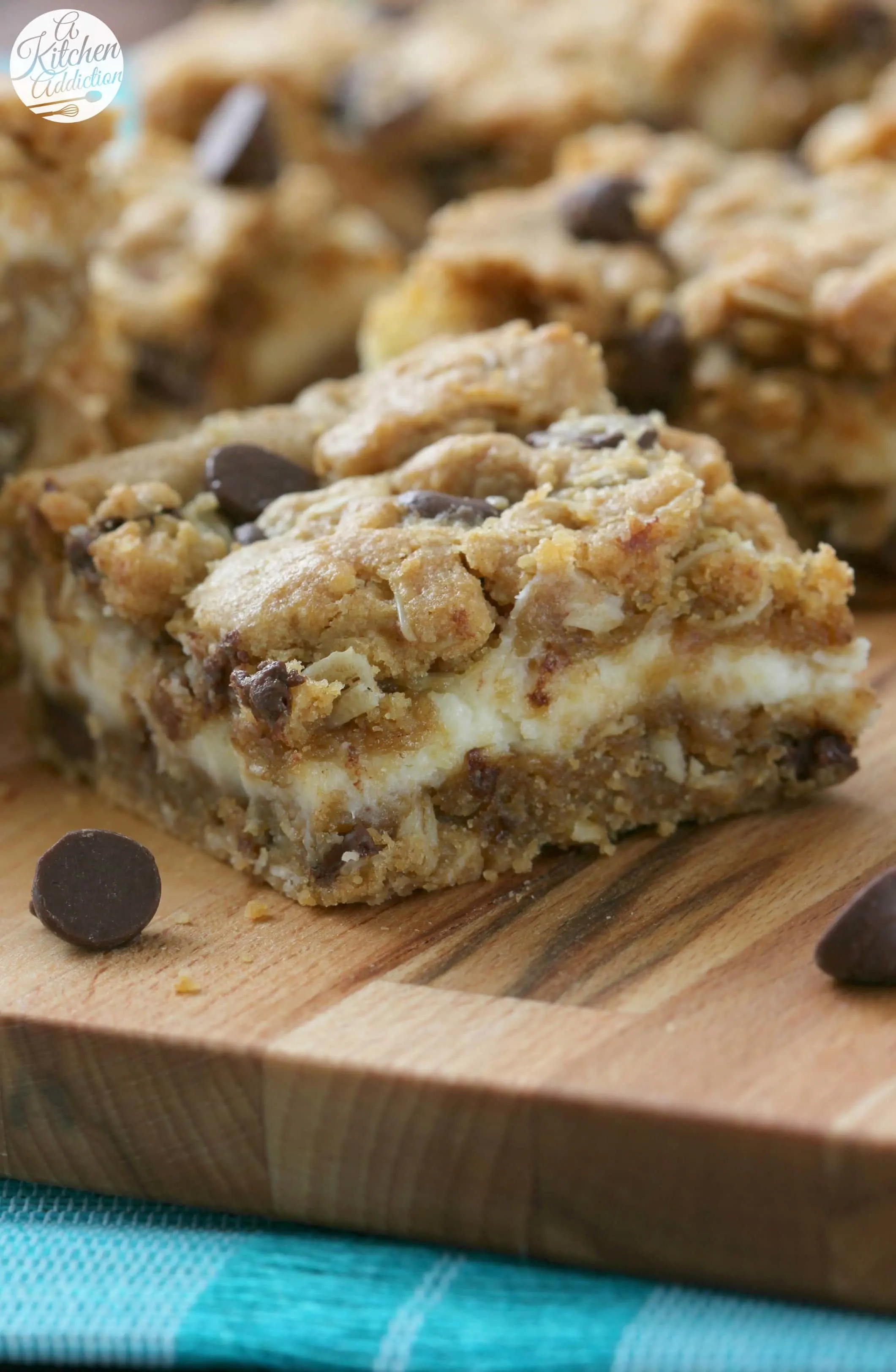 Peanut Butter Chocolate Chip Cheesecake Bars Recipe from A Kitchen Addiction