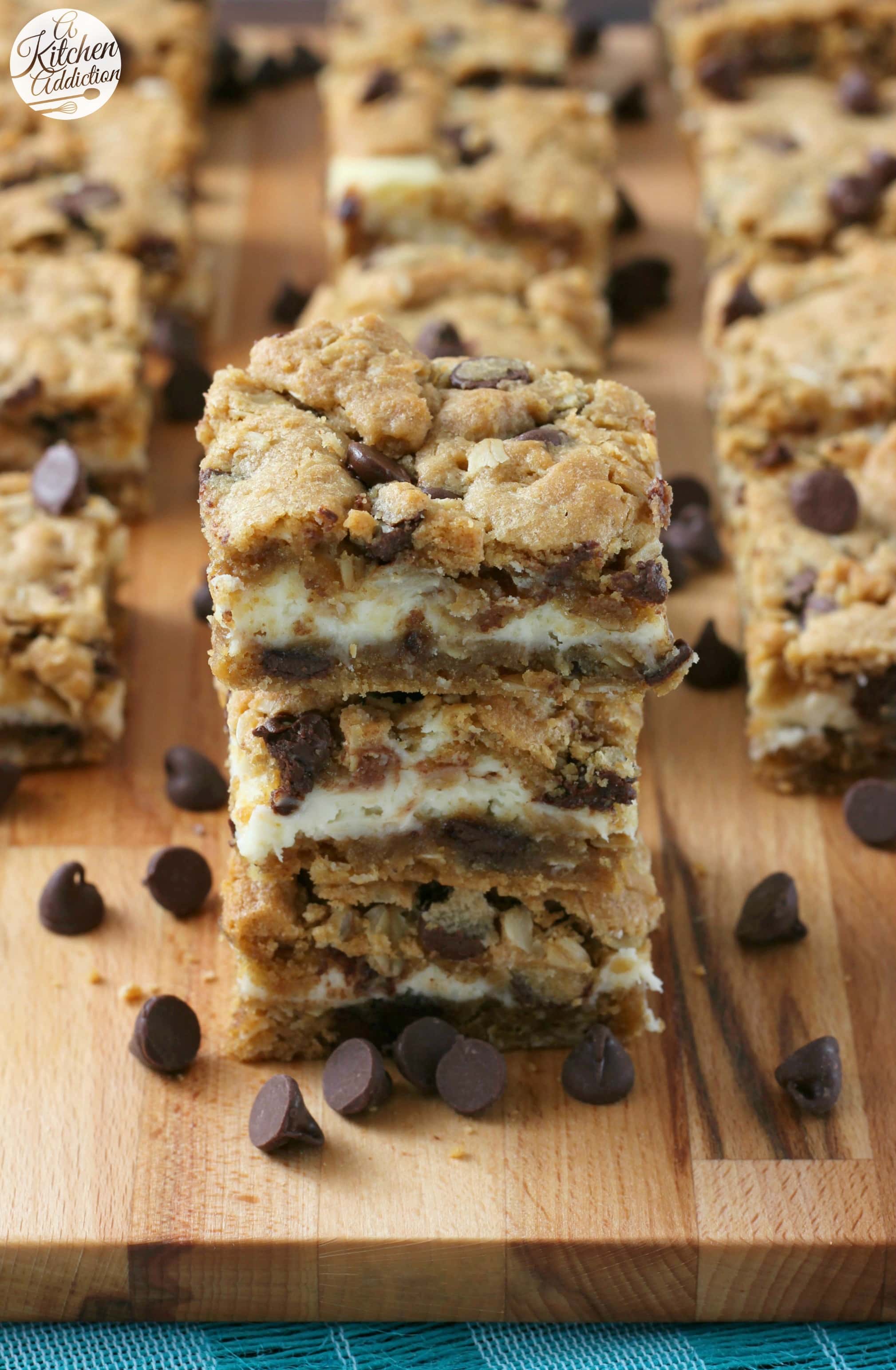 Peanut Butter Chocolate Chip Cookie Cheesecake Bars Recipe from A Kitchen Addiction