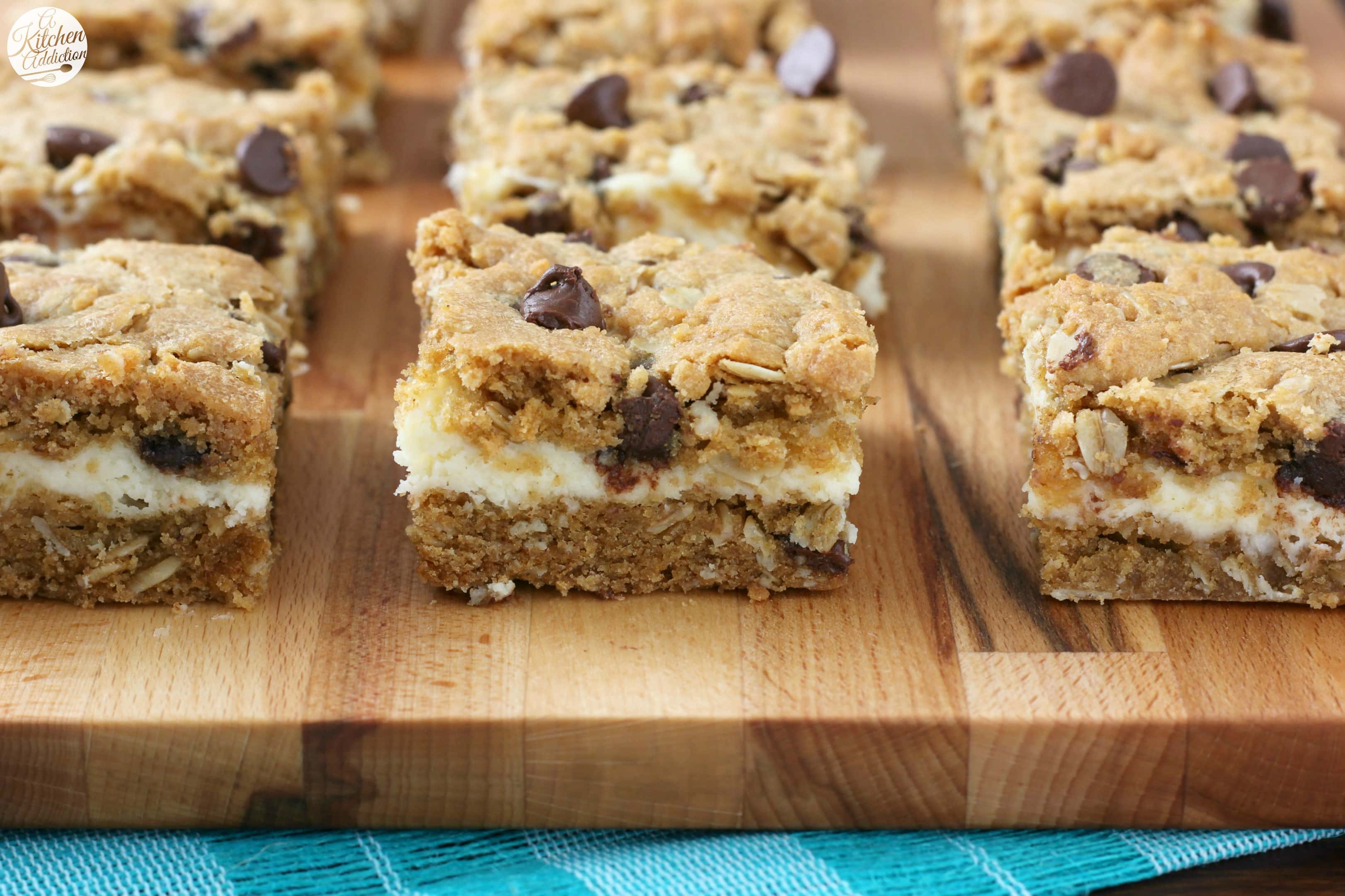 Peanut Butter Chocolate Chip Cookie Cheesecake Bars Recipe from A Kitchen Addiction