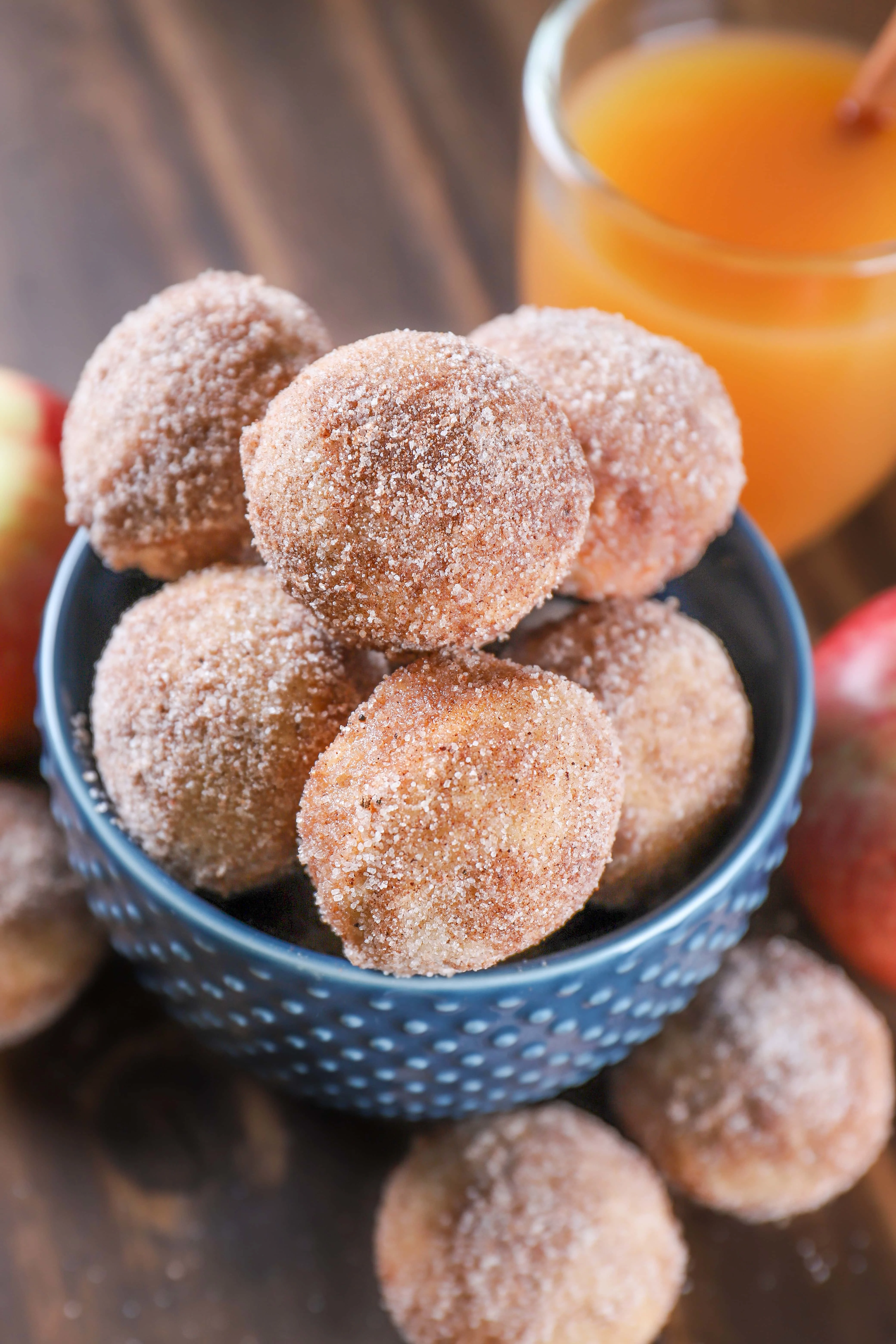 Bowl of Spiced Apple Cider Mini Donut Muffins. Recipe from A Kitchen Addiction