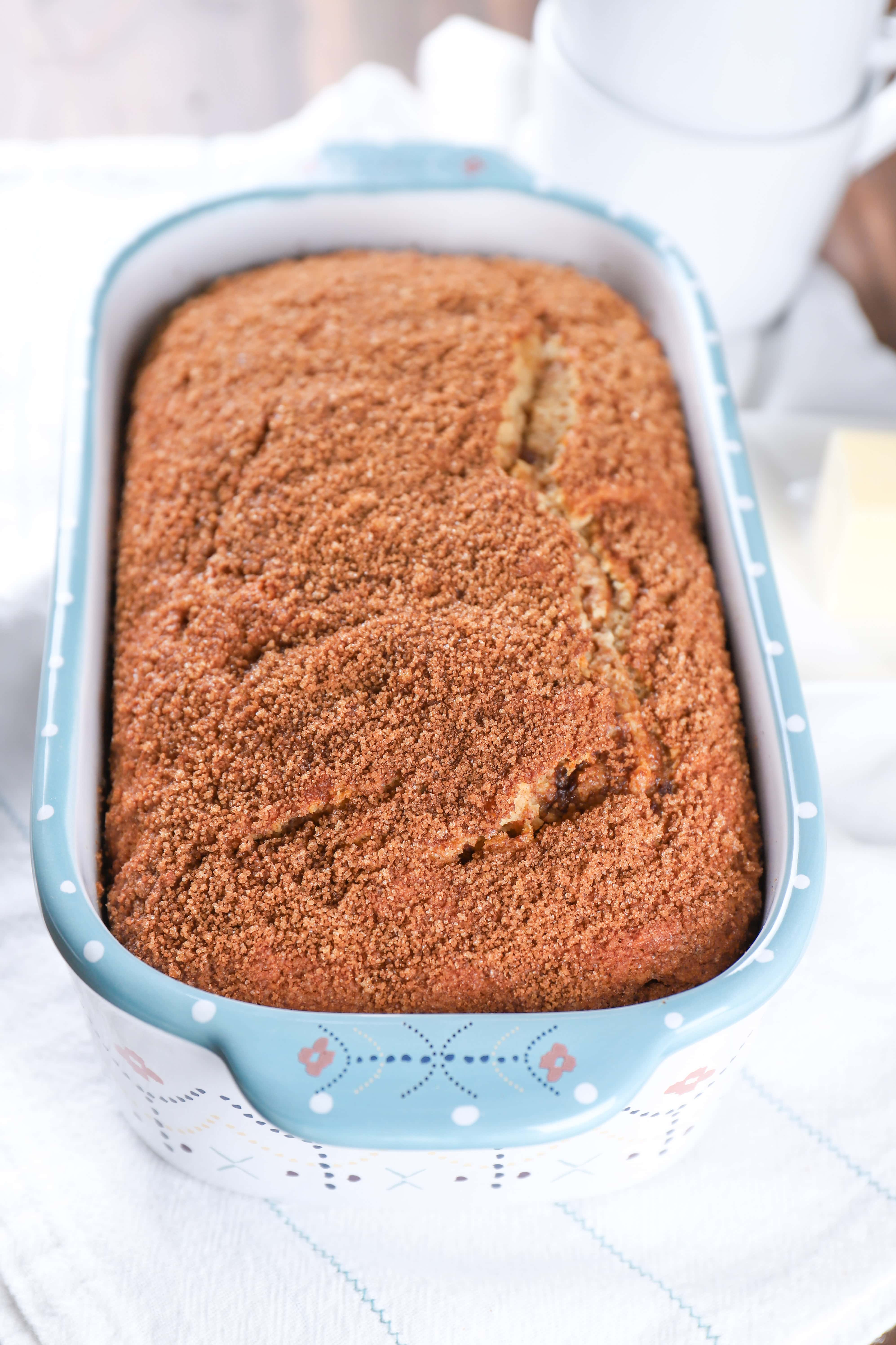 Loaf of cinnamon swirl yogurt bread in pan. Recipe from A Kitchen Addiction.