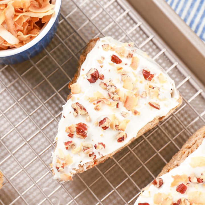 Overhead view of one Carrot Cake Scone on a cooling rack. Recipe from A Kitchen Addiction