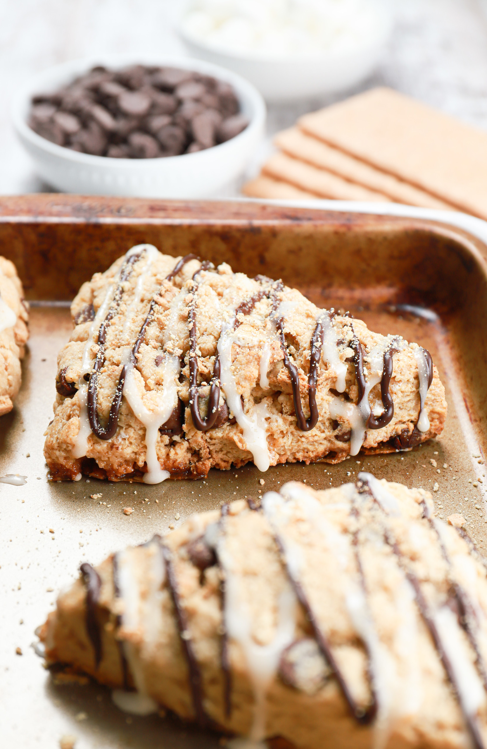 Up close side view of a s'mores scone on a baking sheet.