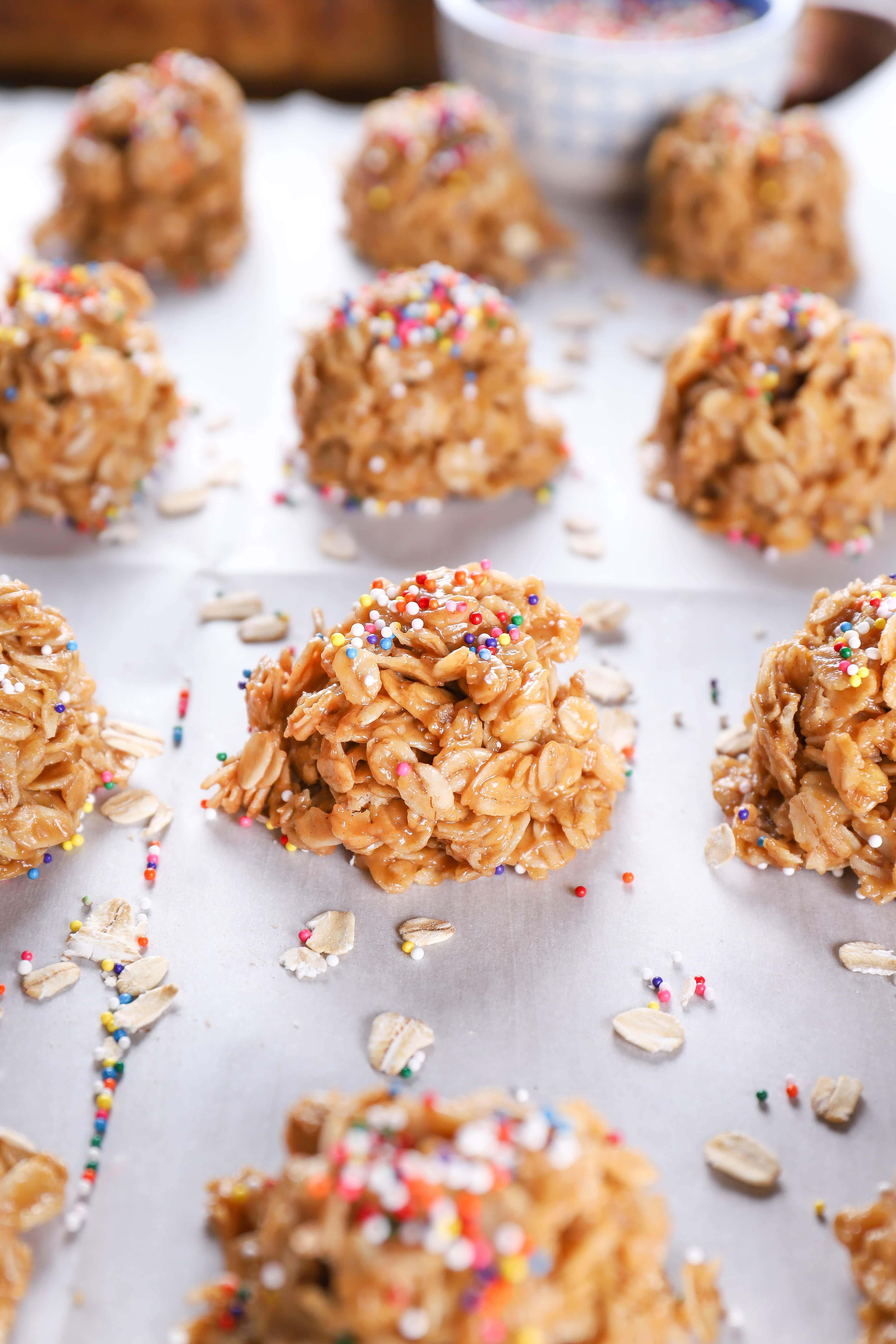 Up close image of a peanut butter honey no bake cookie on a baking sheet full of no bake cookies.