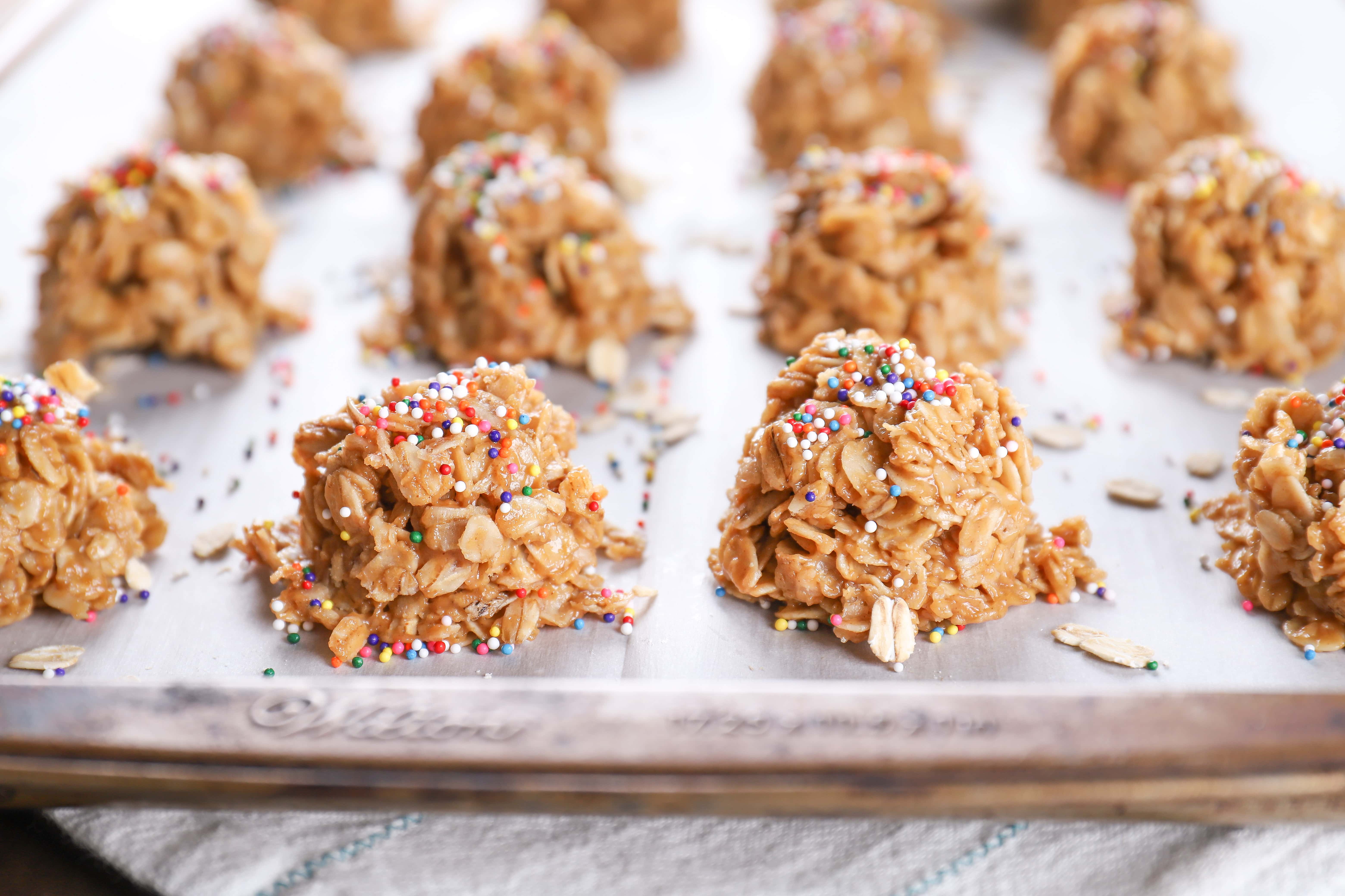 Cookie sheet full of lighter peanut butter honey no bake cookies. Recipe from A Kitchen Addiction