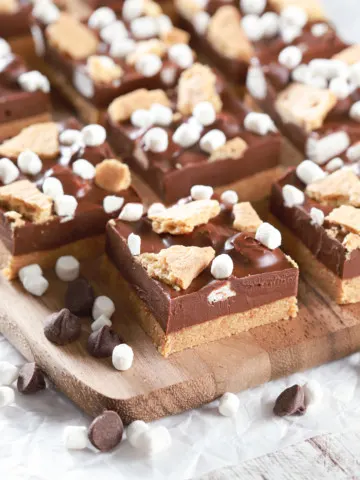No Bake Peanut Butter Smores Bars on a wooden cutting board