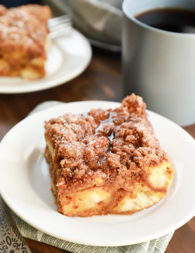 Piece of Pumpkin French Toast Bake with maple syrup. Recipe from A Kitchen Addiction