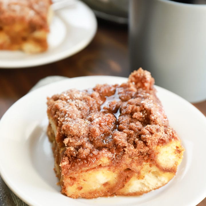 Piece of Pumpkin French Toast Bake with maple syrup. Recipe from A Kitchen Addiction