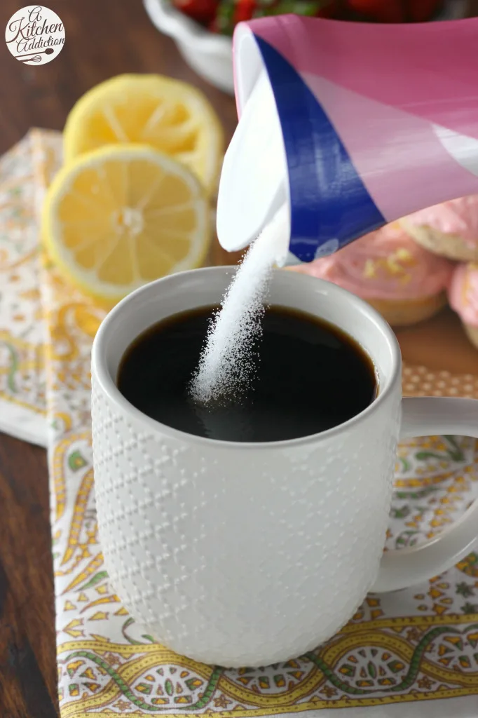 Pouring Sugar in Coffee