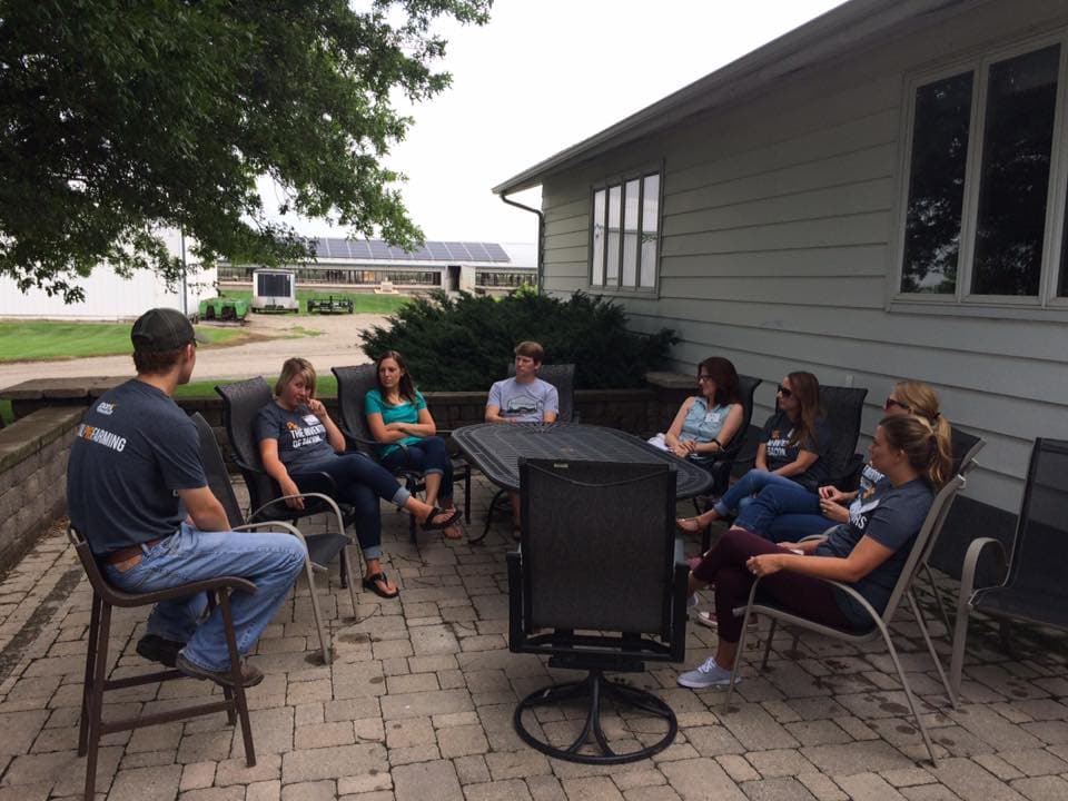 Discussing the pork industry with farmers