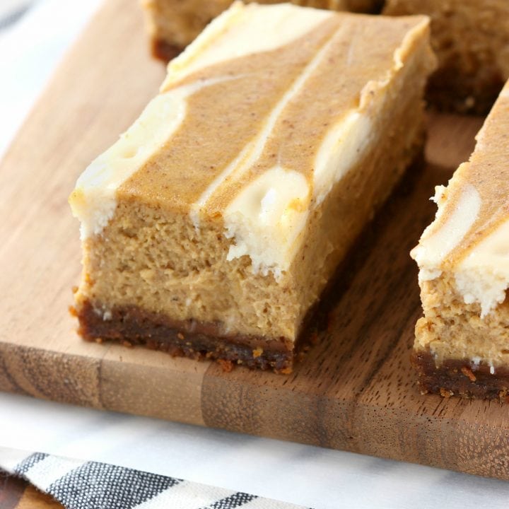 Creamy Swirled Pumpkin Cheesecake Bars with Gingersnap Crust Recipe from A Kitchen Addiction