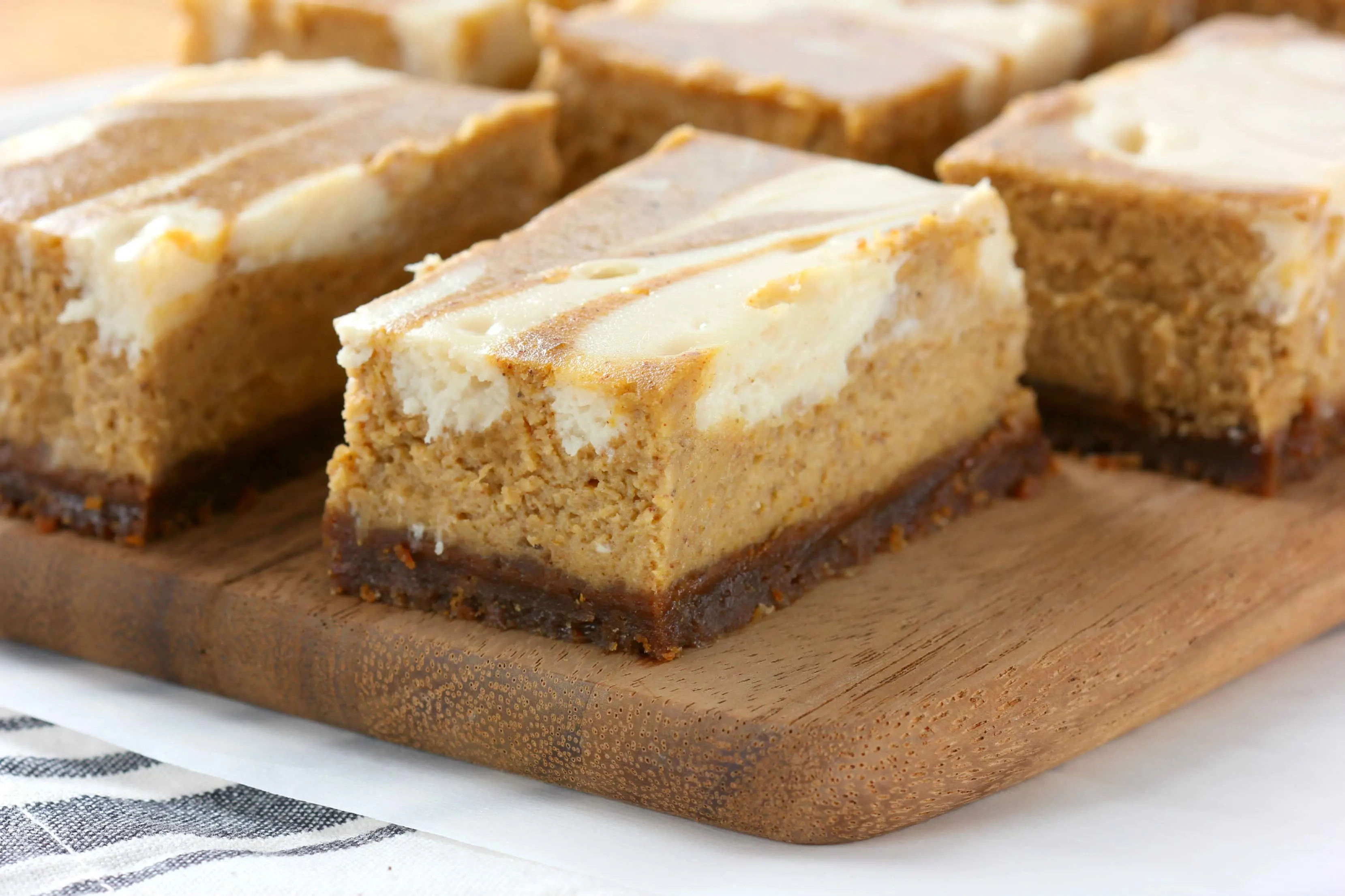 Swirled Pumpkin Cheesecake Bars with Gingersnap Crust Recipe from A Kitchen Addiction