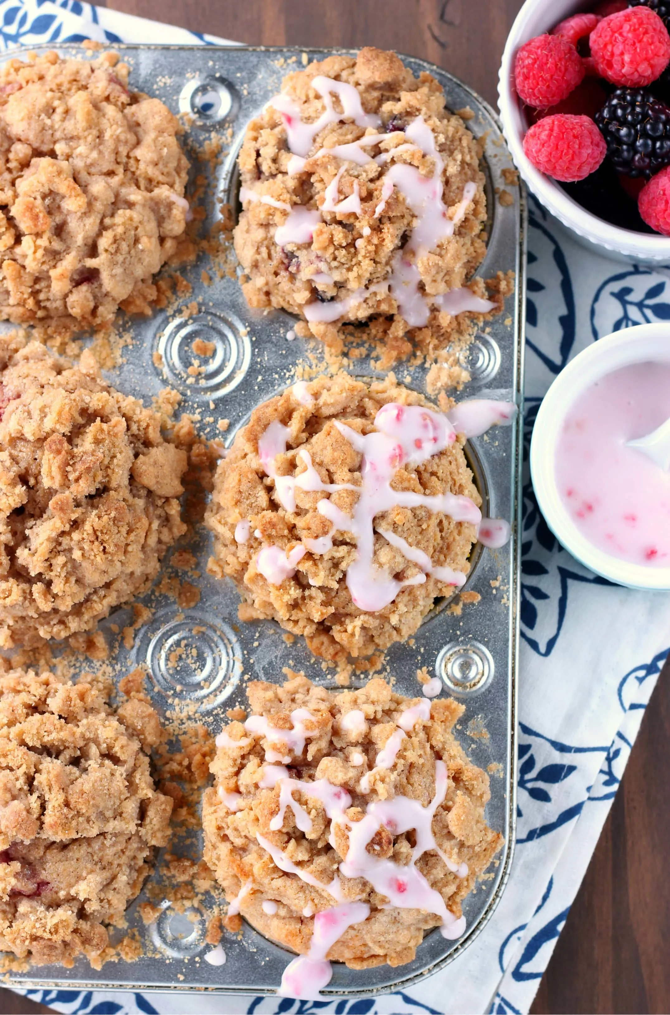 Mixed Berry Coffee Cake Muffins with Raspberry Drizzle Recipe from A Kitchen Addiction