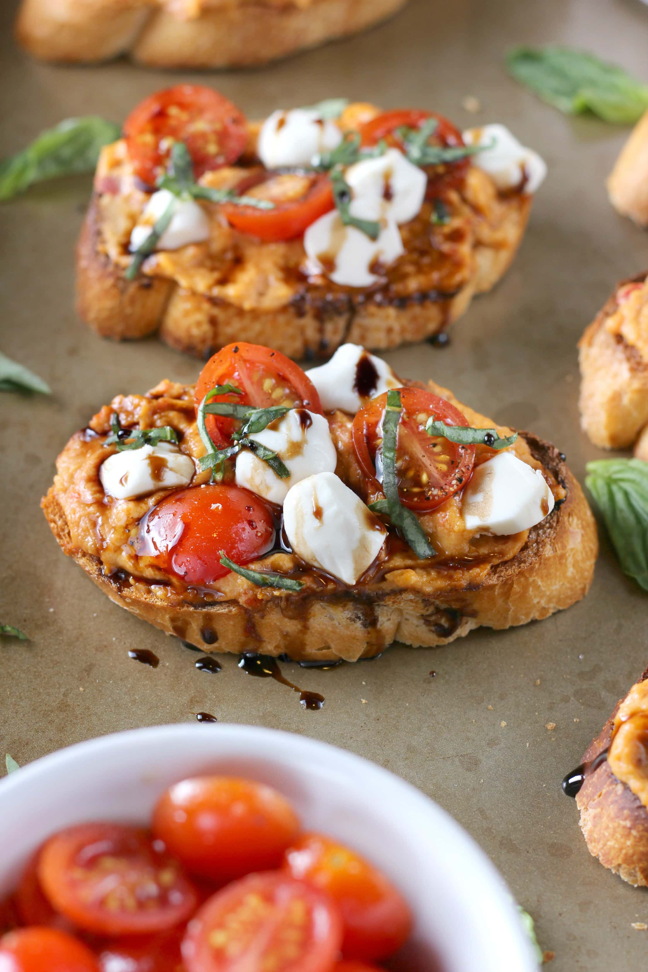 Caprese Roasted Red Pepper Hummus Crostini Recipe from A Kitchen Addiction