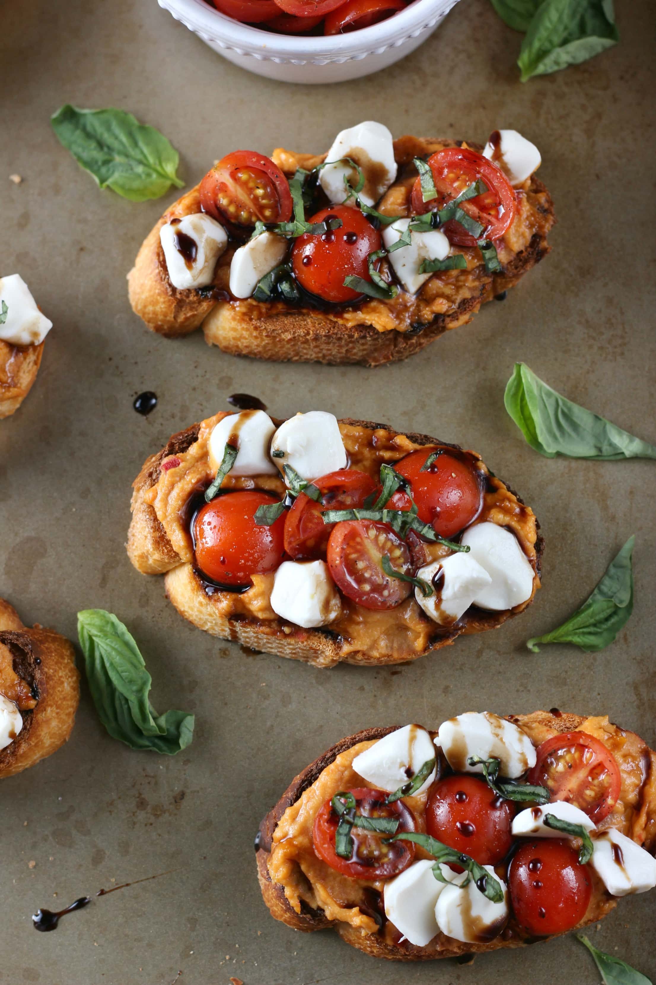 Caprese Roasted Red Pepper Hummus Crostini Recipe from A Kitchen Addiction