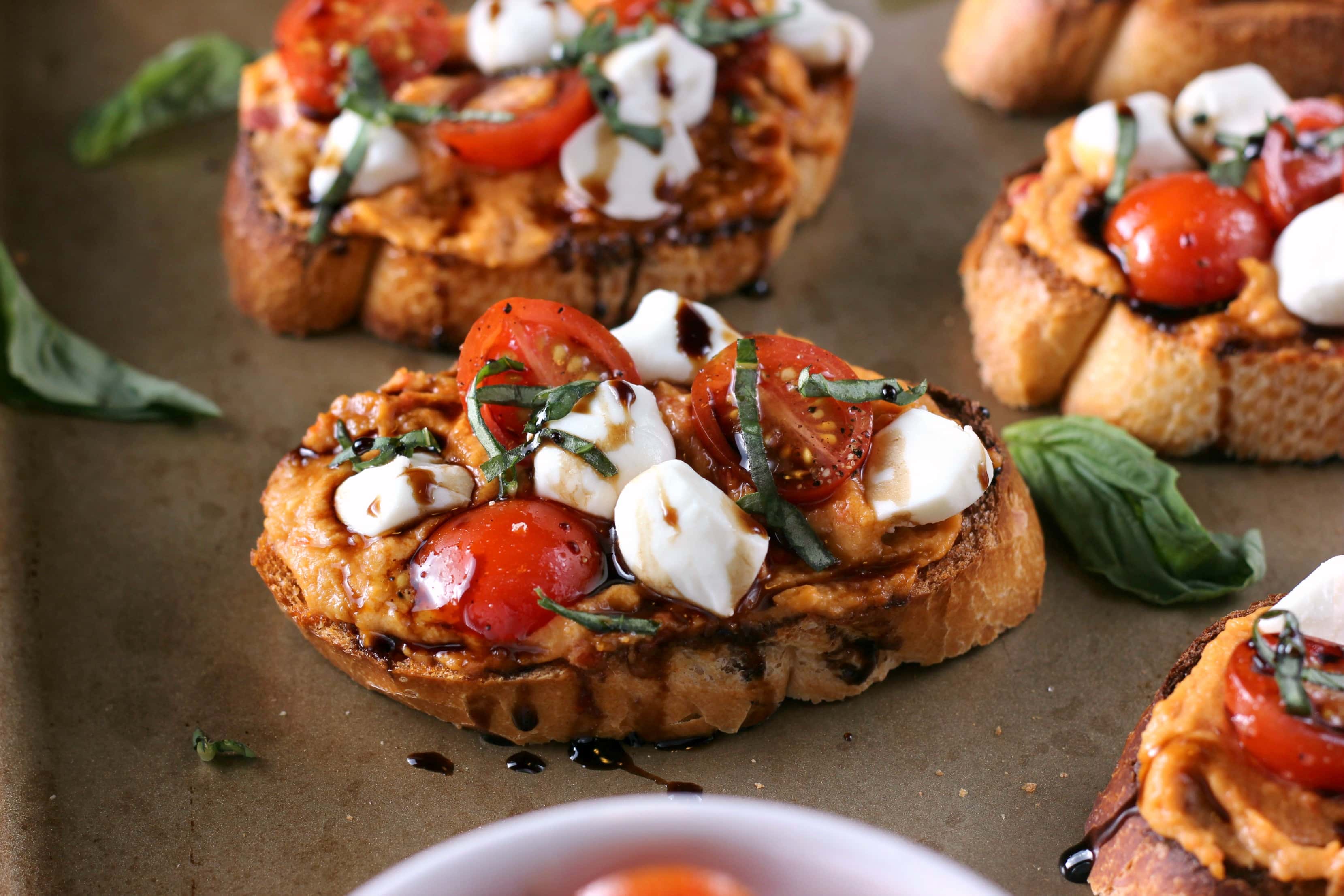 Caprese Roasted Red Pepper Hummus Crostini