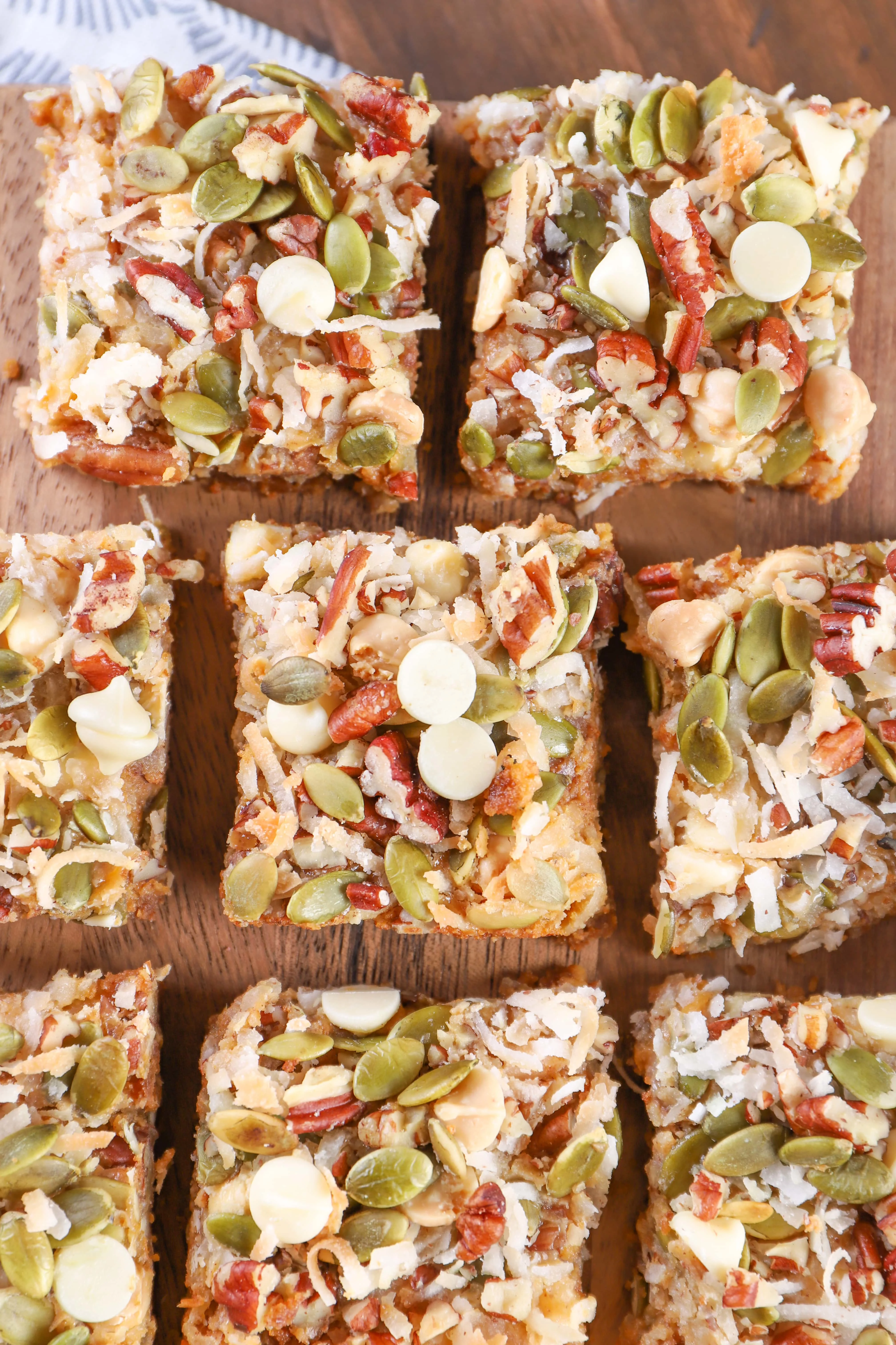 Pumpkin Magic Bars arranged on a cutting board