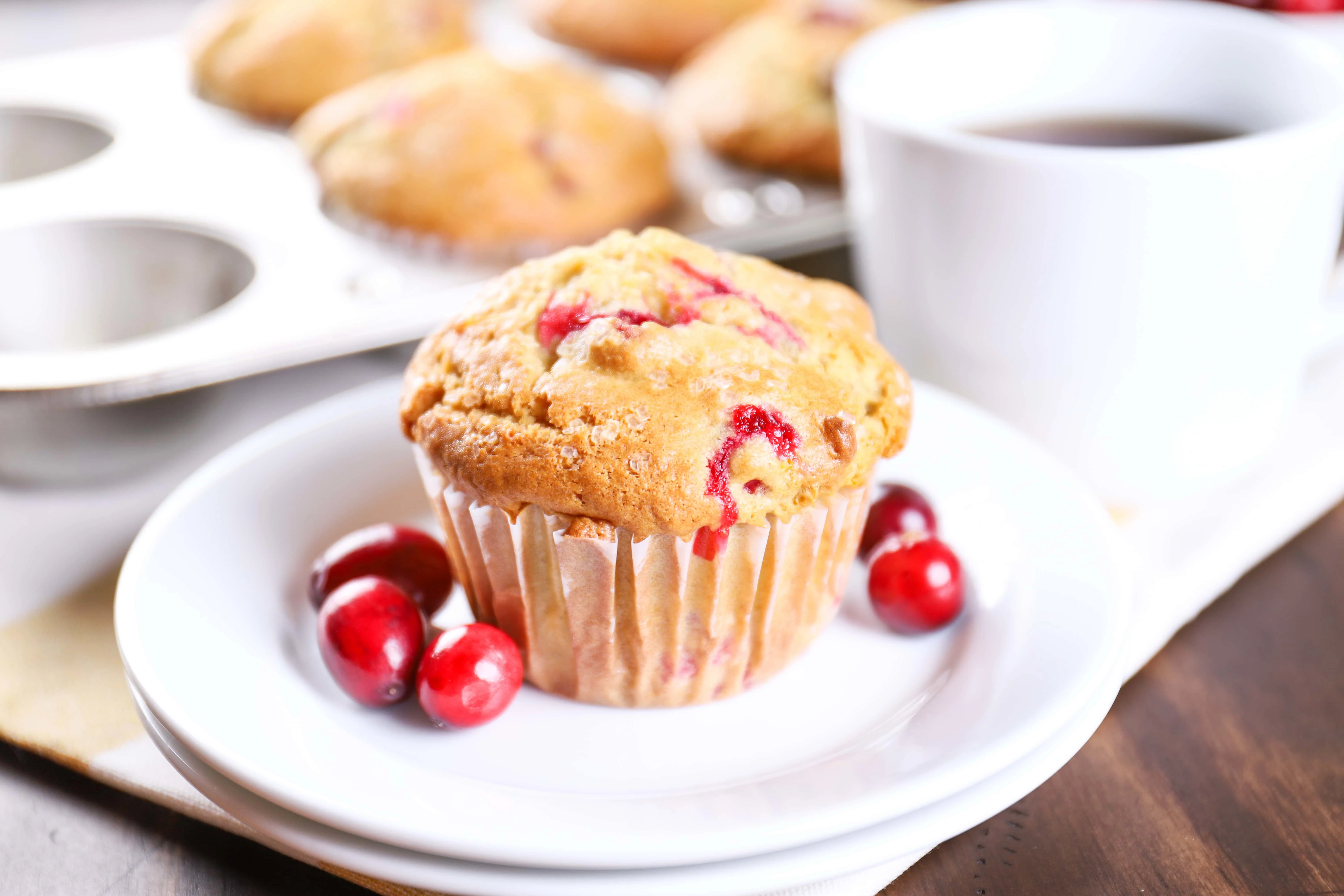Plated Cranberry Orange Muffins. Recipe from A Kitchen Addiction