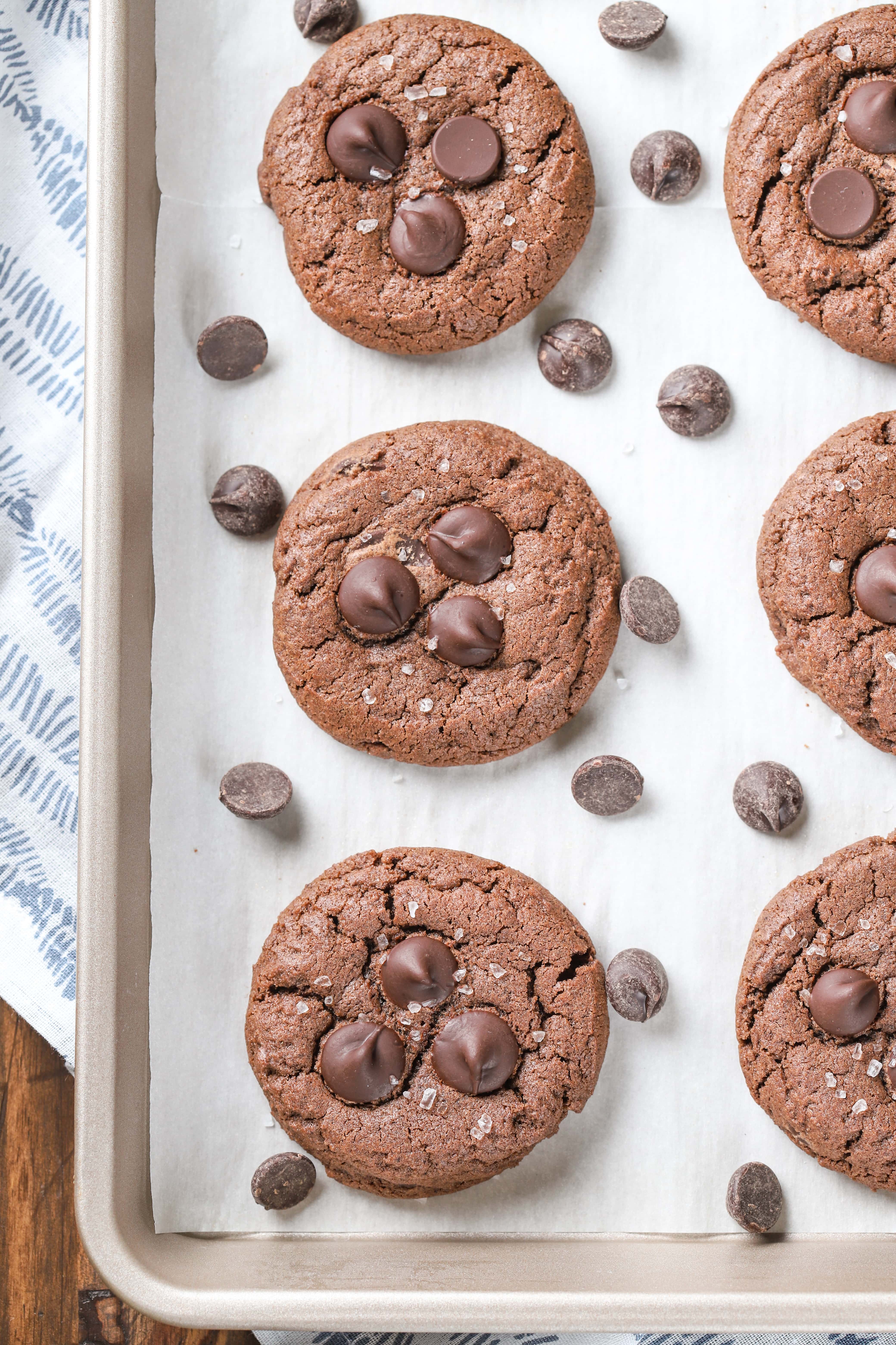 Salted Dark Chocolate Cookies on cookie sheet. Recipe from A Kitchen Addiction