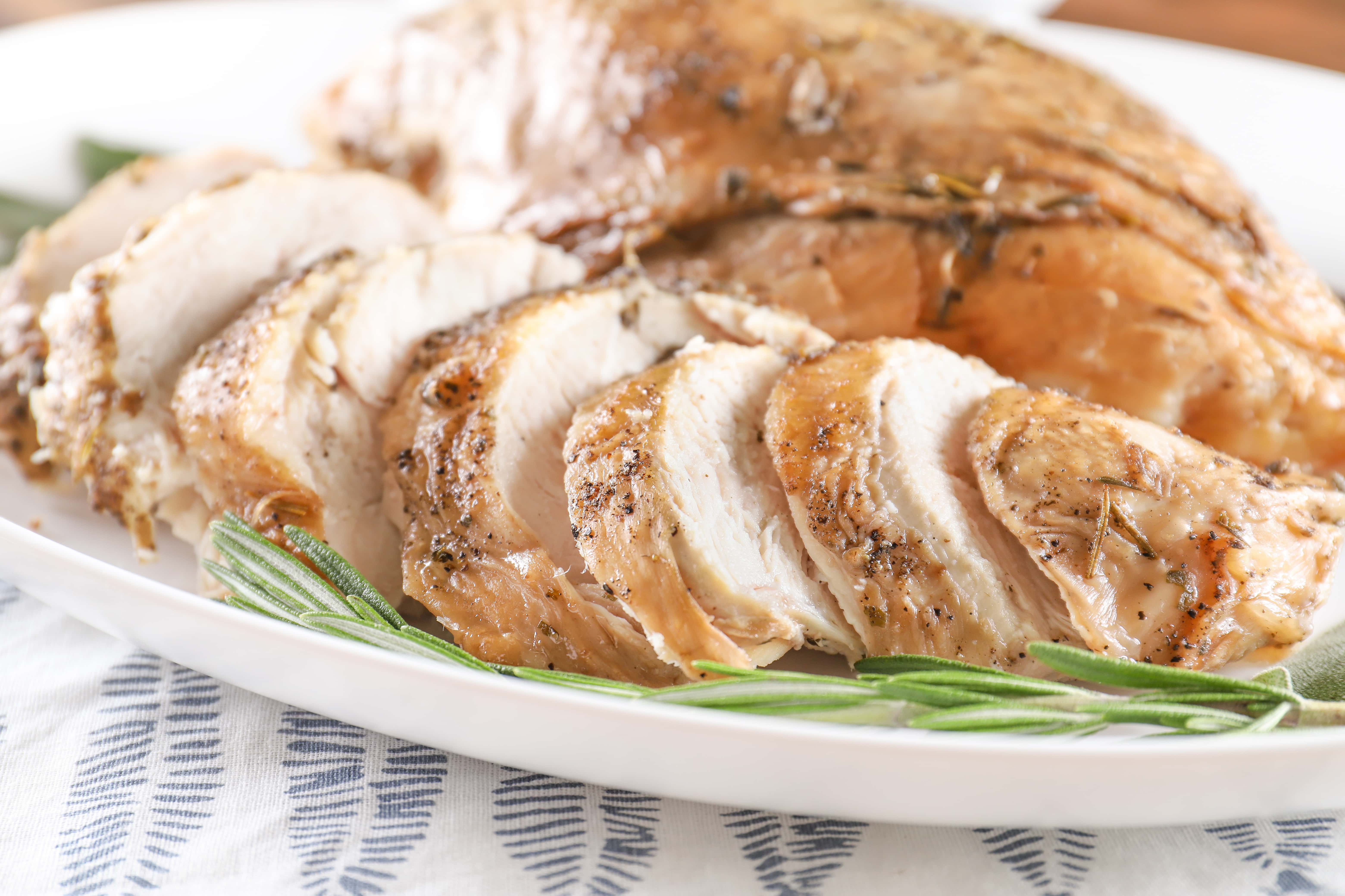 Sliced Slow Cooker Apple Cider Brined Turkey Breast on a plate. Recipe from A Kitchen Addiction