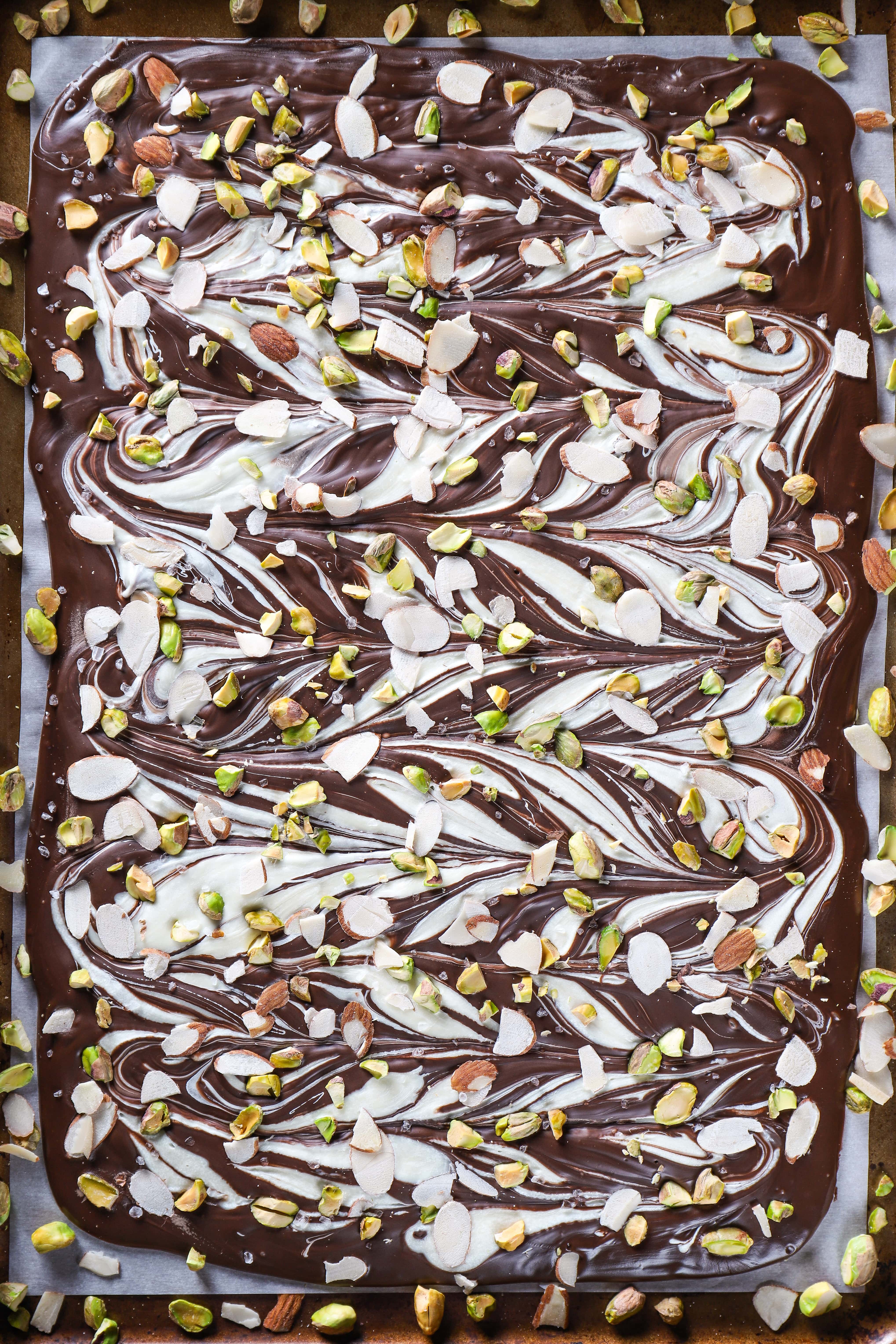 Sheet Pan of Salted Dark Chocolate Almond Pistachio Bark. Recipe from A Kitchen Addiction