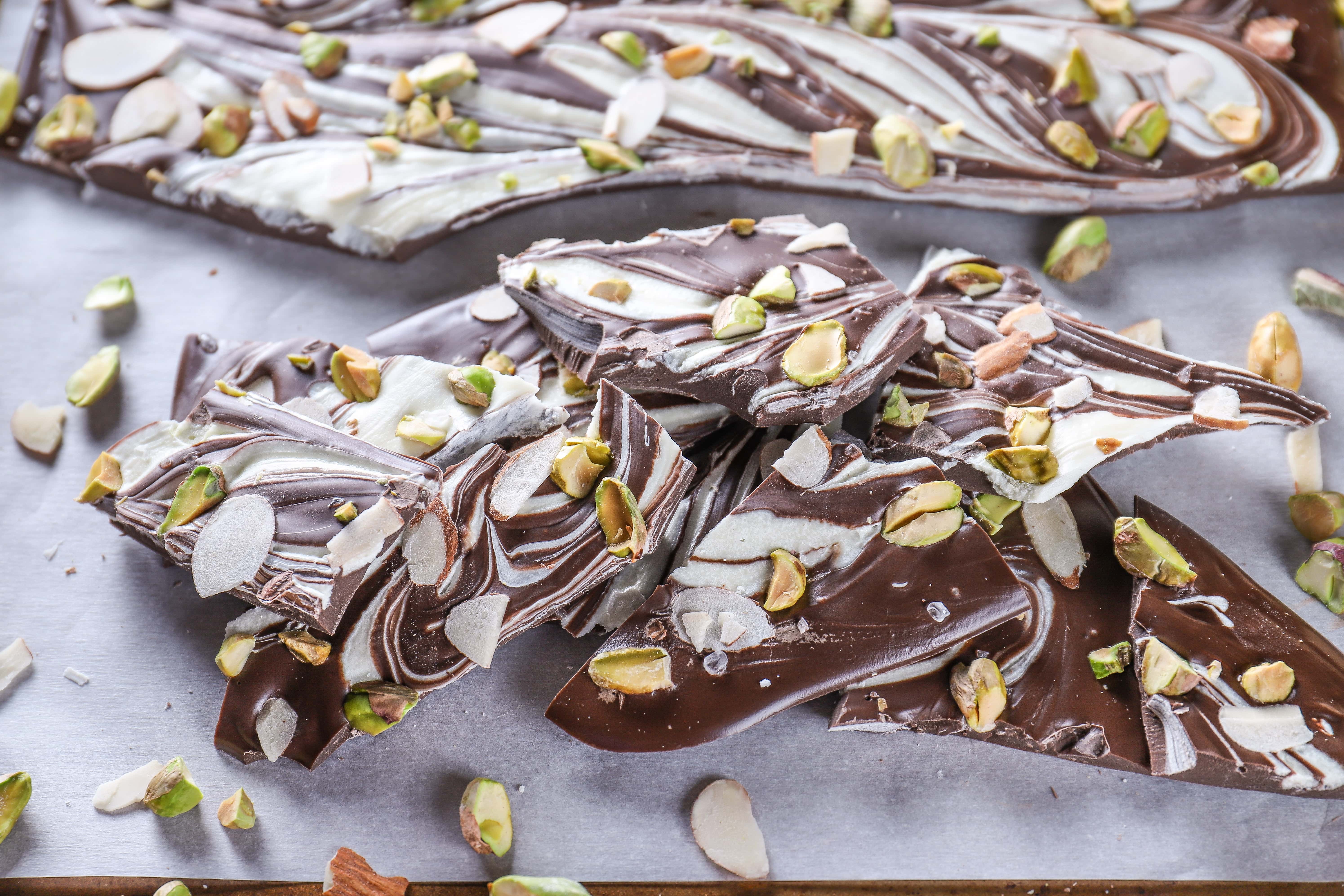 Stack of Salted Dark Chocolate Almond Pistachio Bark. Recipe from A Kitchen Addiction