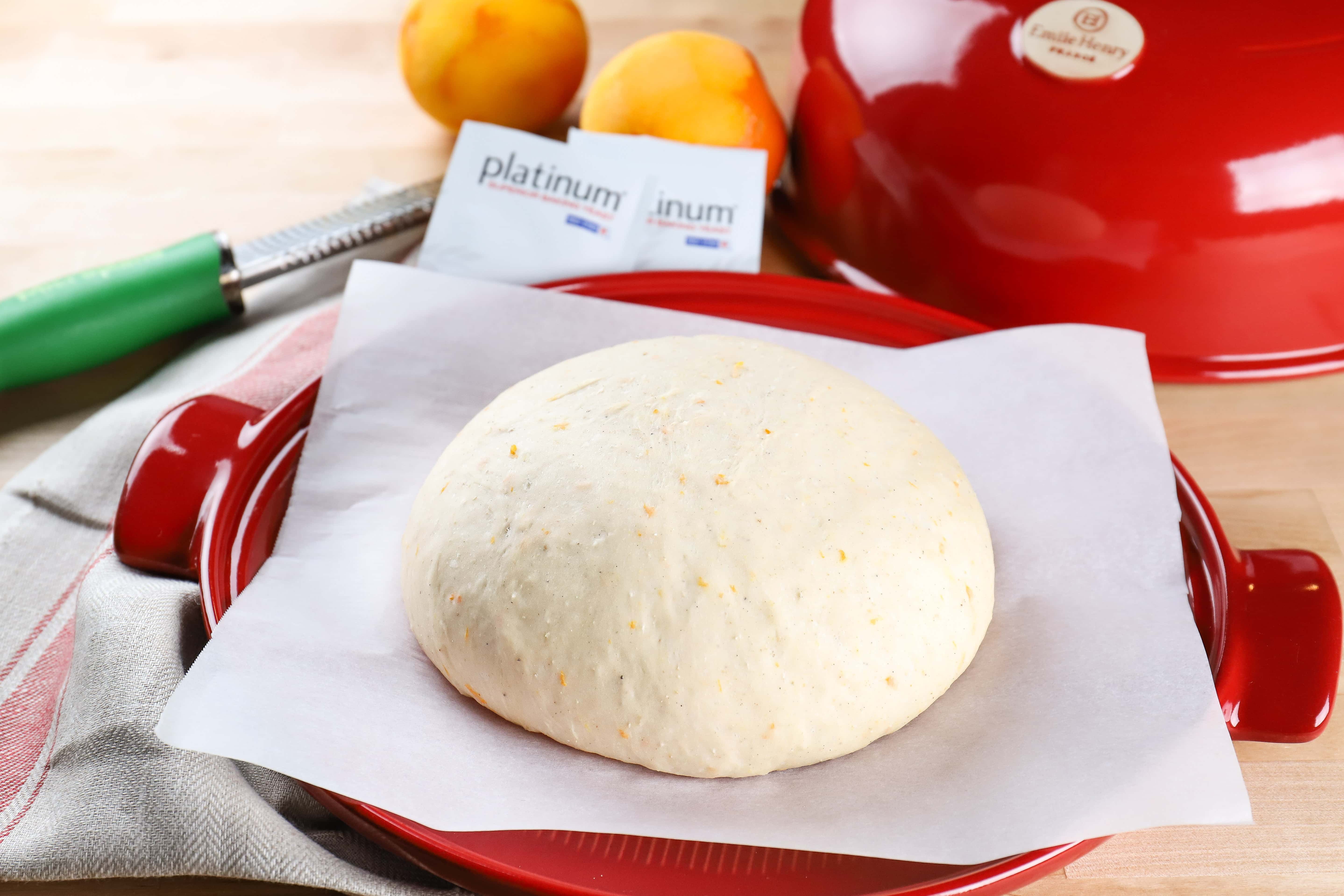 orange cardamom bread dough on emile henry bread cloche