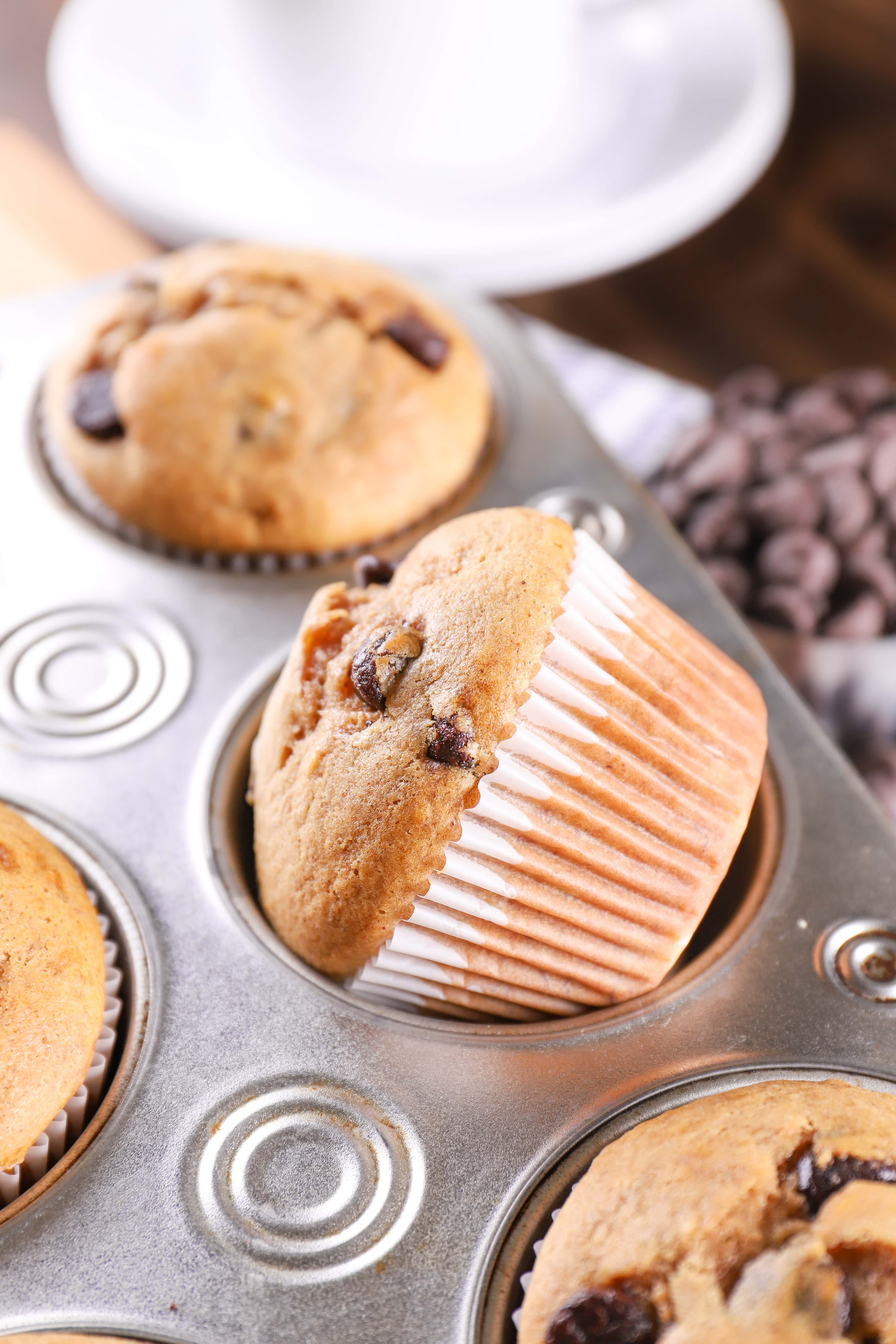 Chocolate Chip Almond Butter Protein Muffin in a muffin tin. Recipe for protein muffins from A Kitchen Addiction