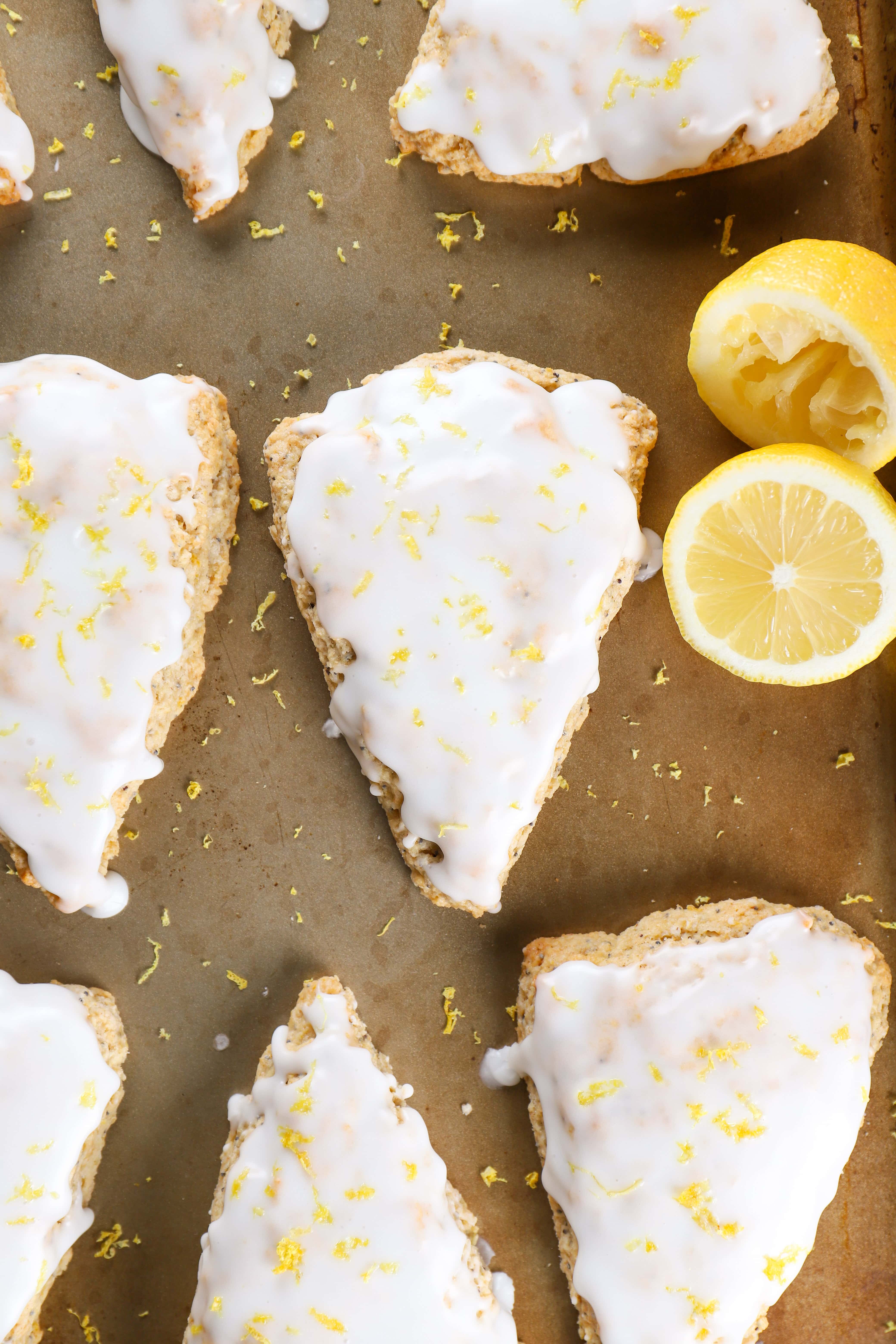 Baking Sheet Full of Glazed Lemon Poppy Seed Scones