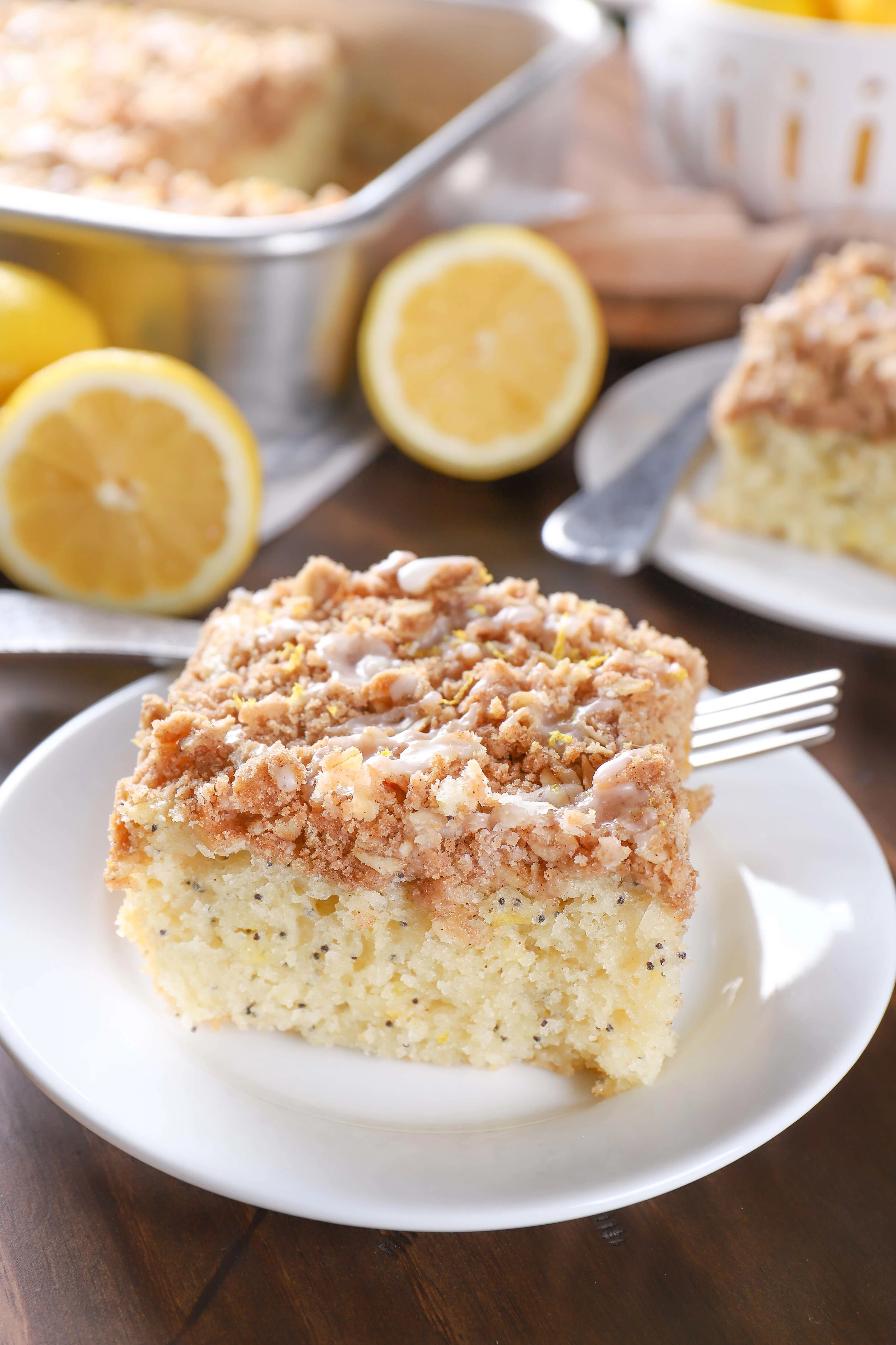 Piece of Lemon Poppy Seed Cake on a small white plate.