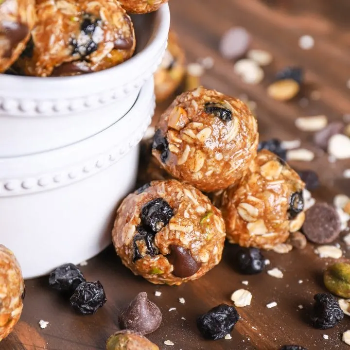 Up close image of a stack of dark chocolate blueberry pistachio granola bites.