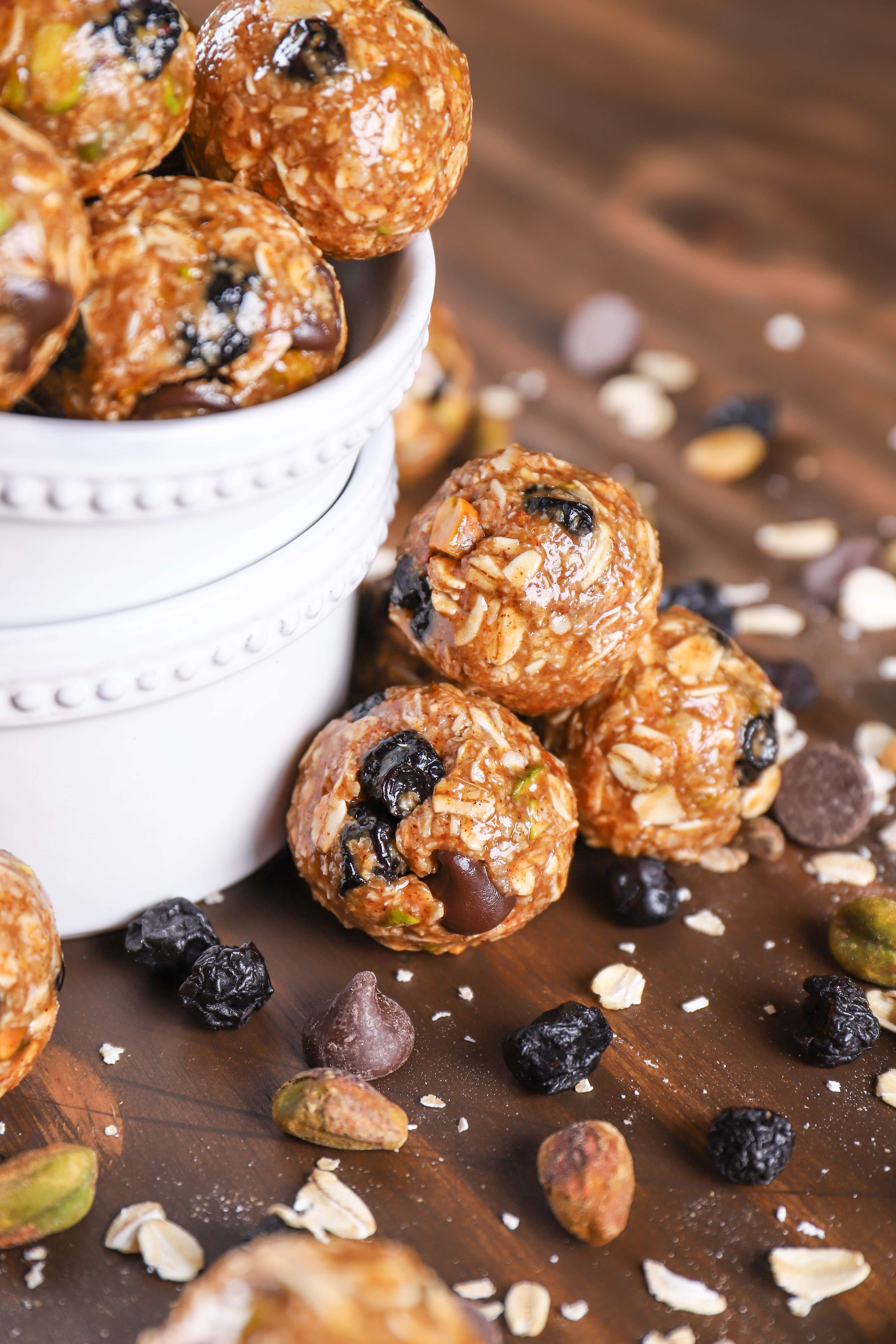 Up close image of a stack of dark chocolate blueberry pistachio granola bites.