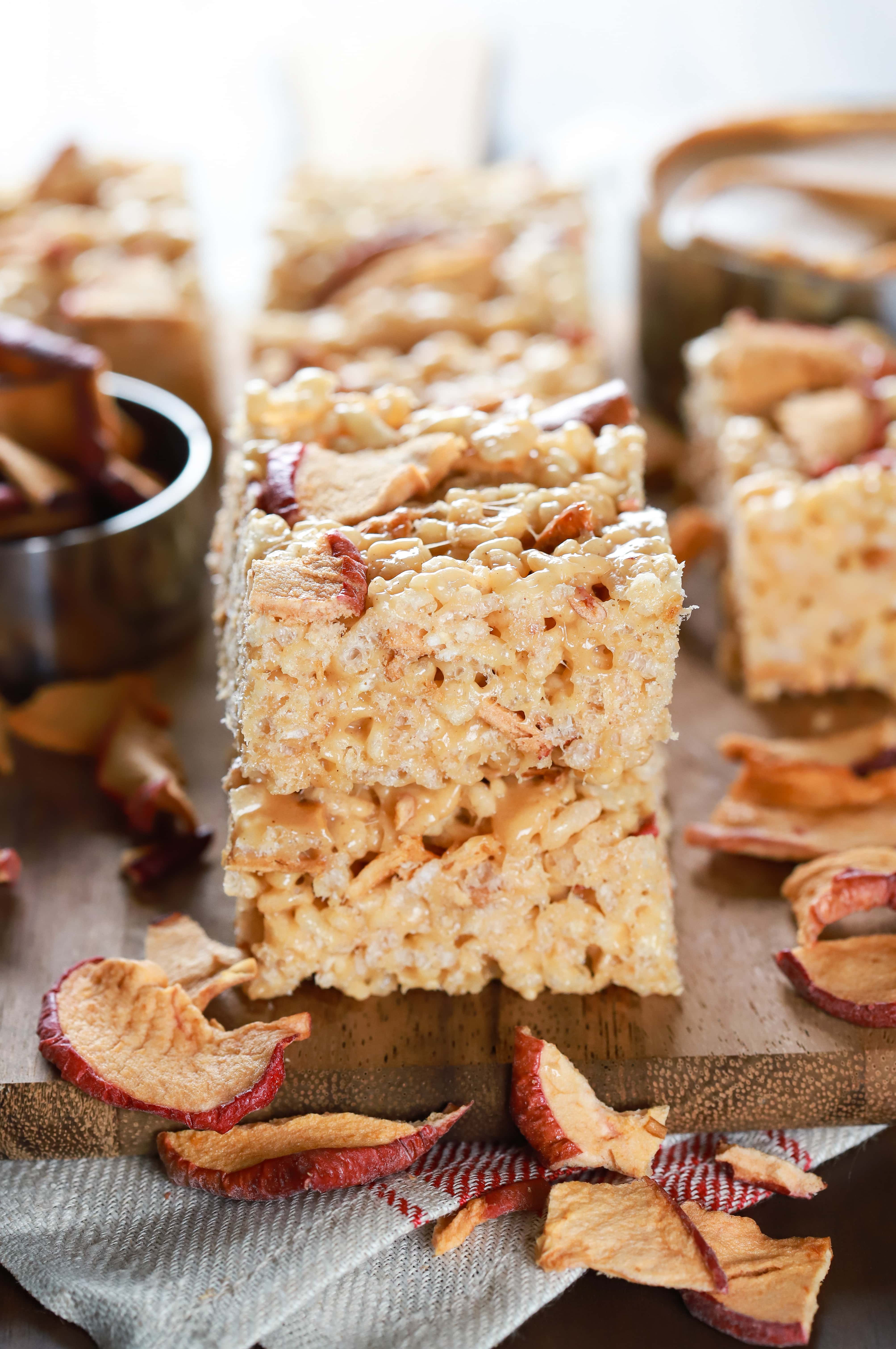 Stack of apple peanut butter rice crispy treats on a cutting board. Recipe from A Kitchen Addiction