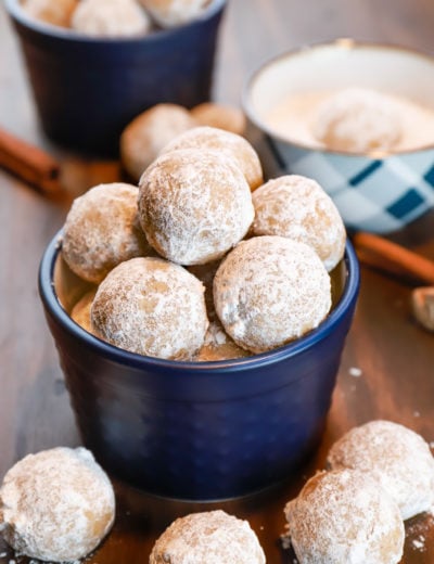 Gingerbread snowball cookies in a blue dish. Recipe from A Kitchen Addiction