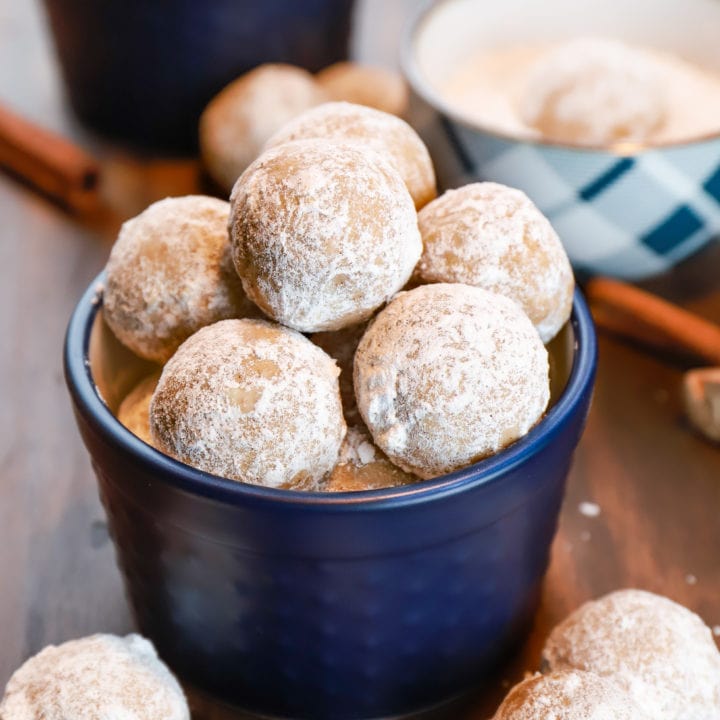 Gingerbread snowball cookies in a blue dish. Recipe from A Kitchen Addiction