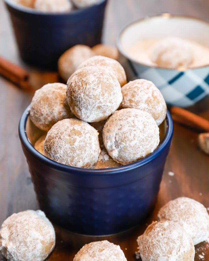 Gingerbread snowball cookies in a blue dish. Recipe from A Kitchen Addiction