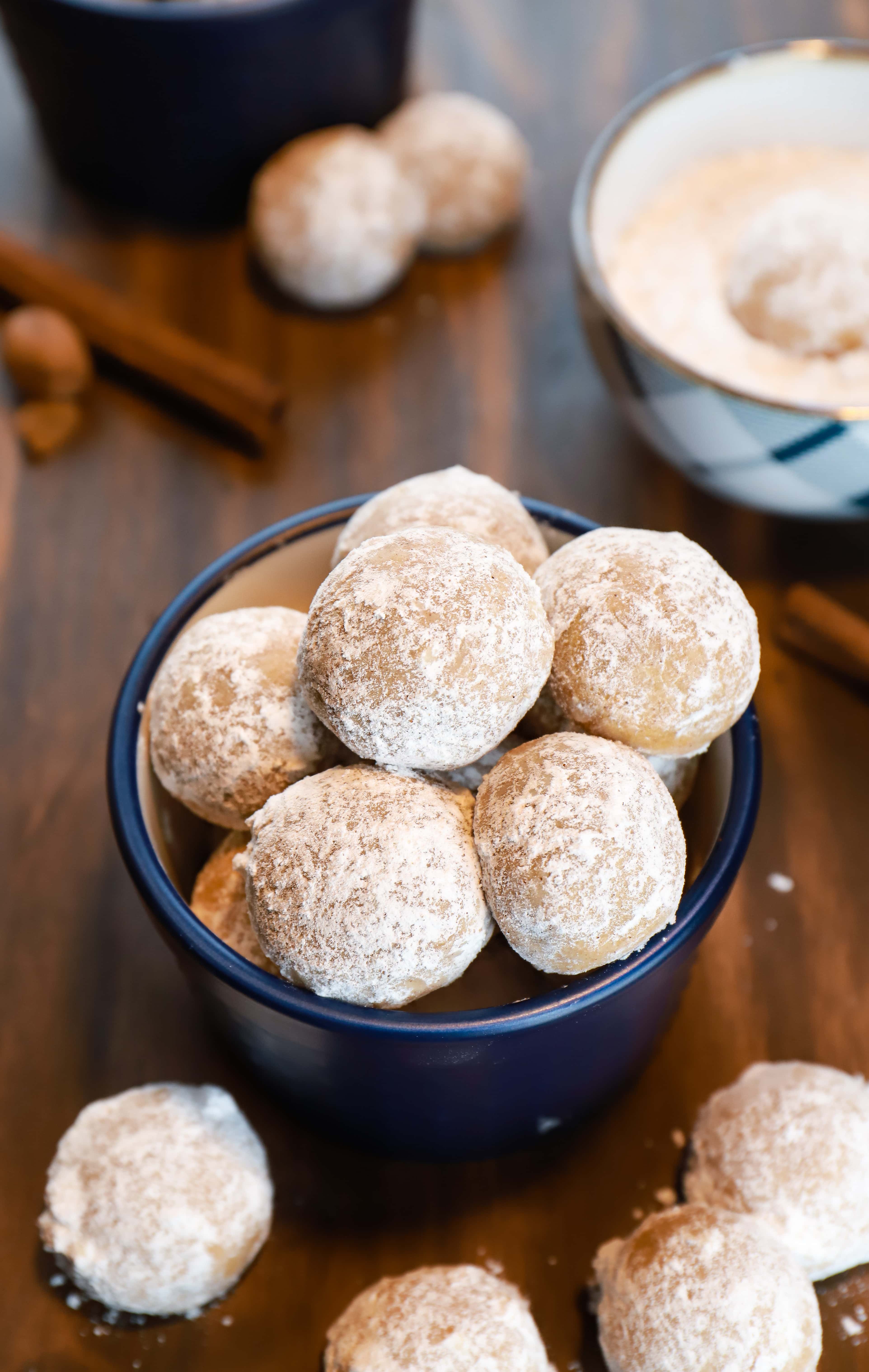 Gingerbread snowball cookies in blue dishes on table. Recipe from A Kitchen Addiction