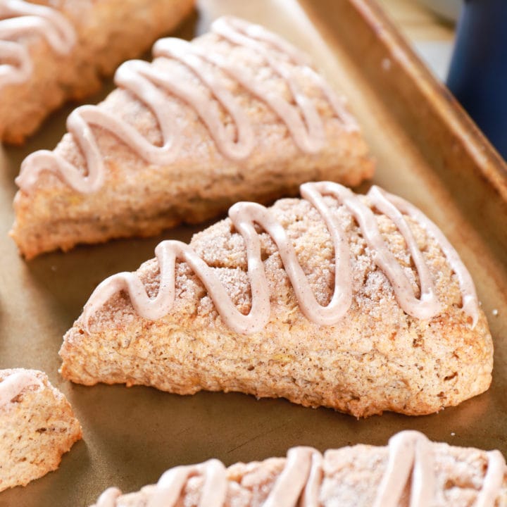 Up close image of Banana Snickerdoodle Scones on a baking sheet. Recipe for scones from A Kitchen Addiction