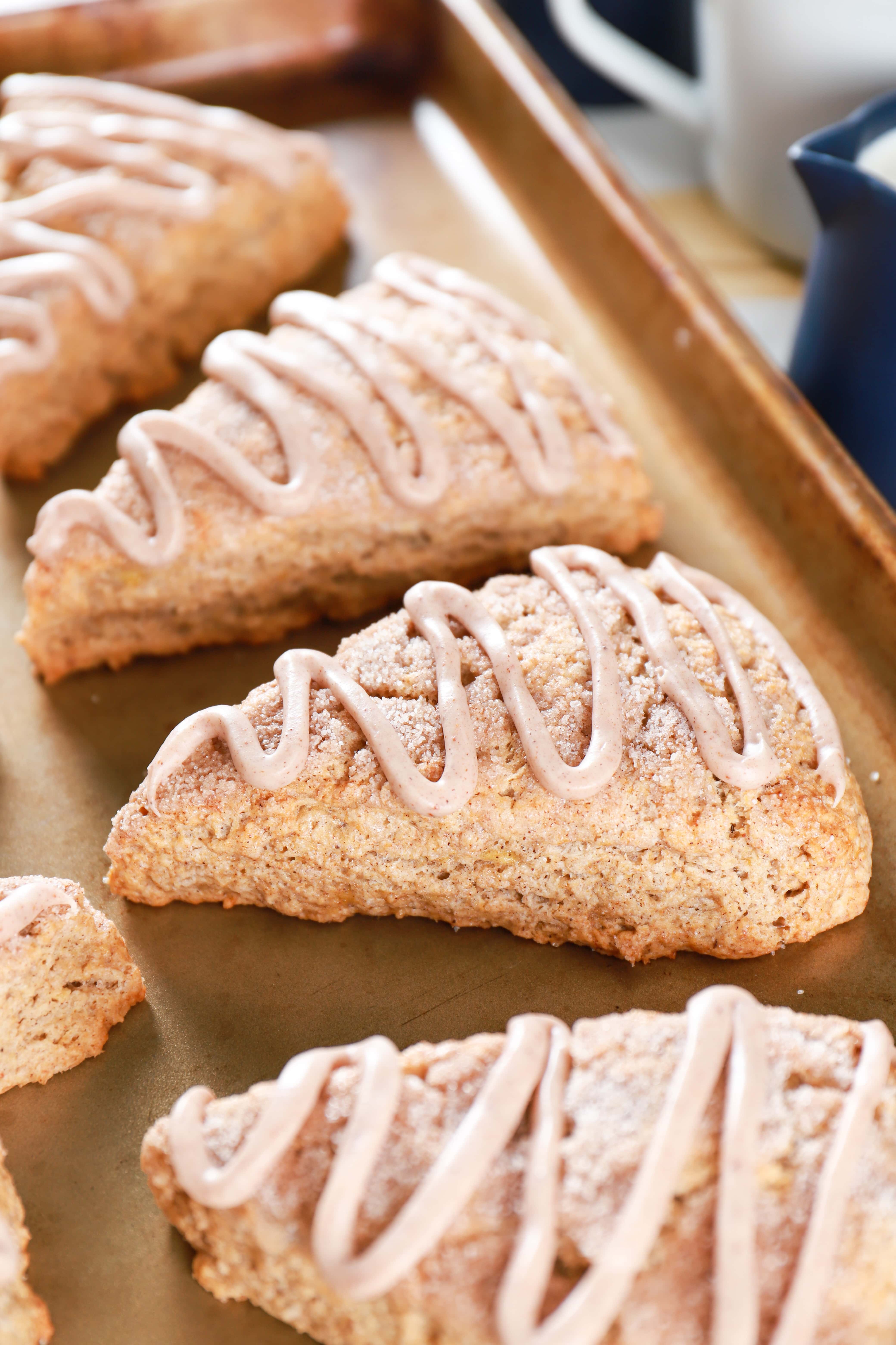 Up close image of Banana Snickerdoodle Scones on a baking sheet. Recipe for scones from A Kitchen Addiction