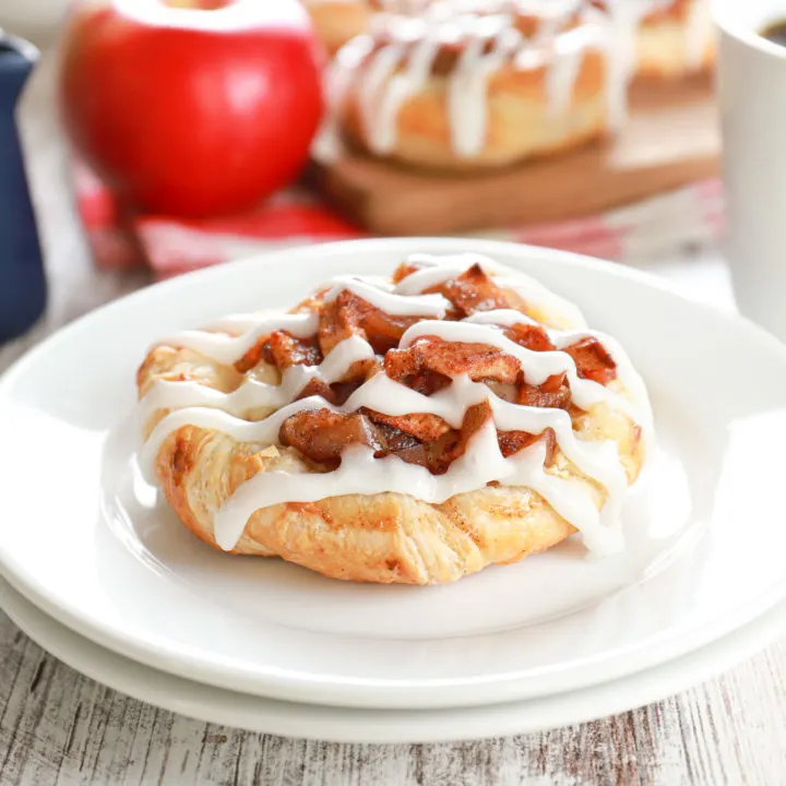 apple cream cheese danish on a small white plate
