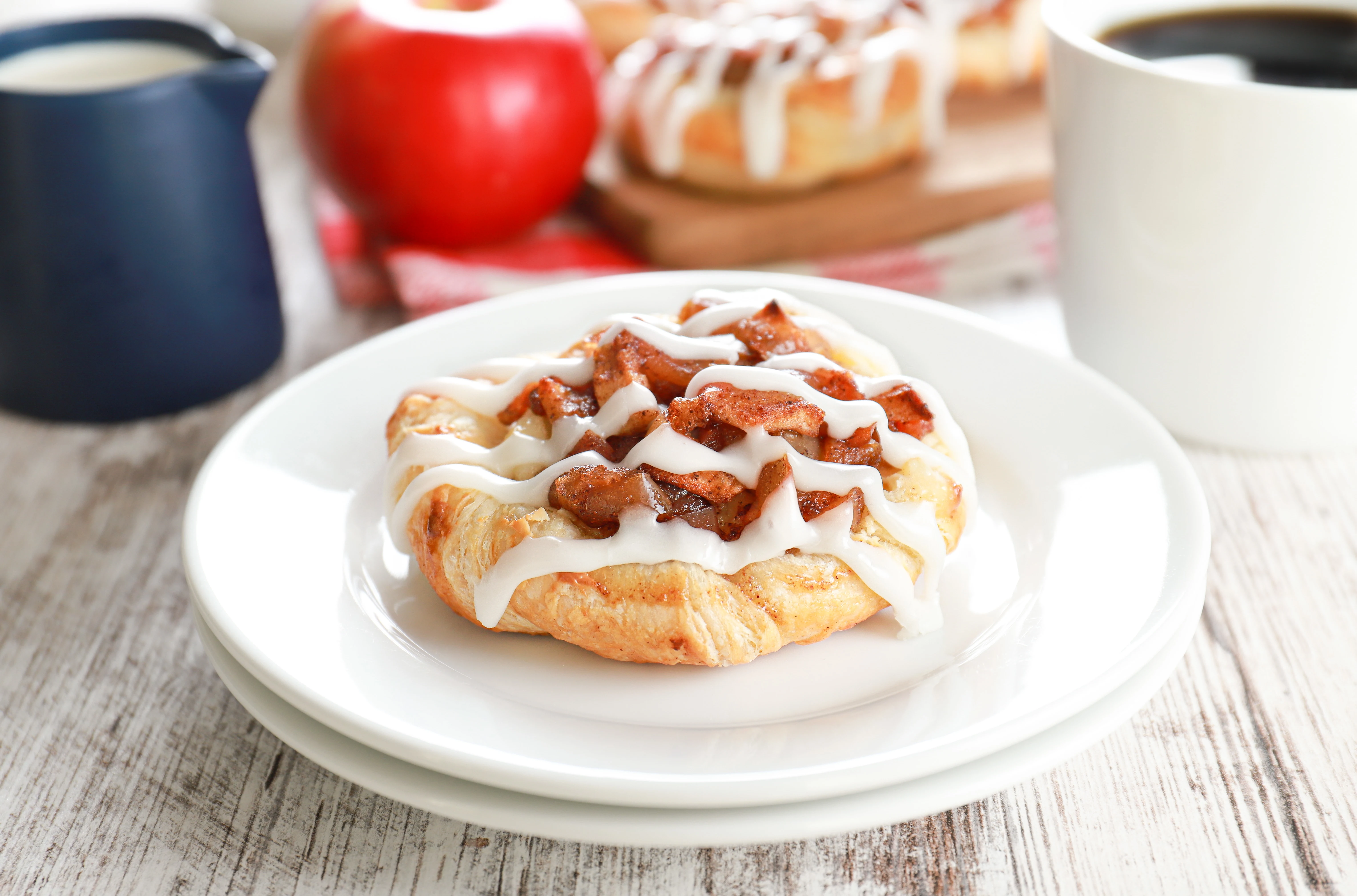 apple cream cheese danish on a small white plate