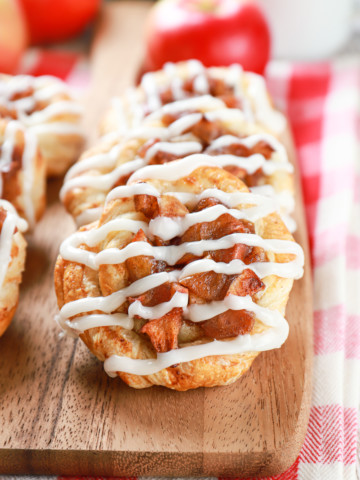 apple cream cheese danishes on a wooden cutting board