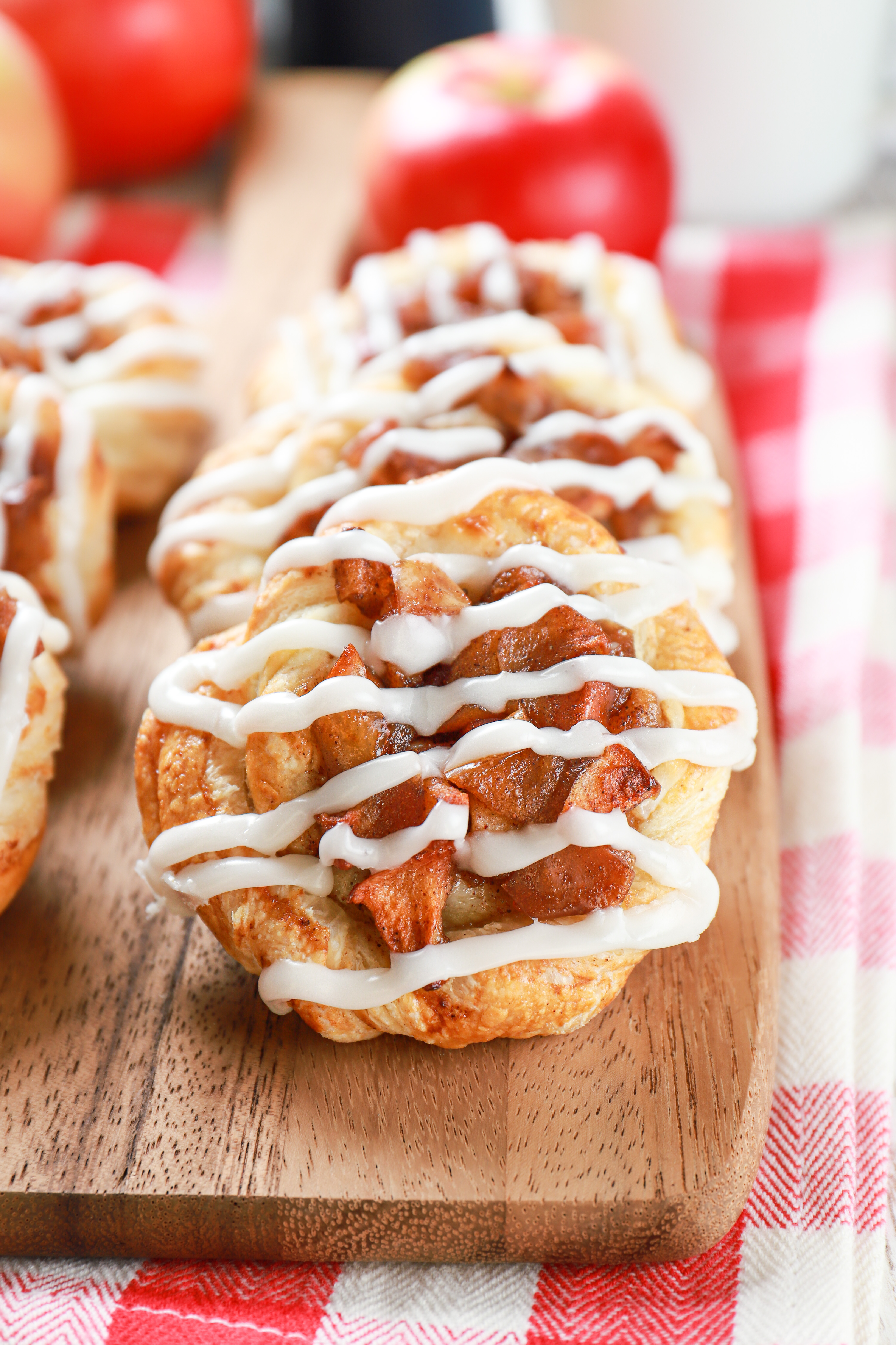 apple cream cheese danishes on a wooden cutting board