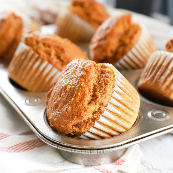 Bakery style pumpkin muffins in a muffin tin