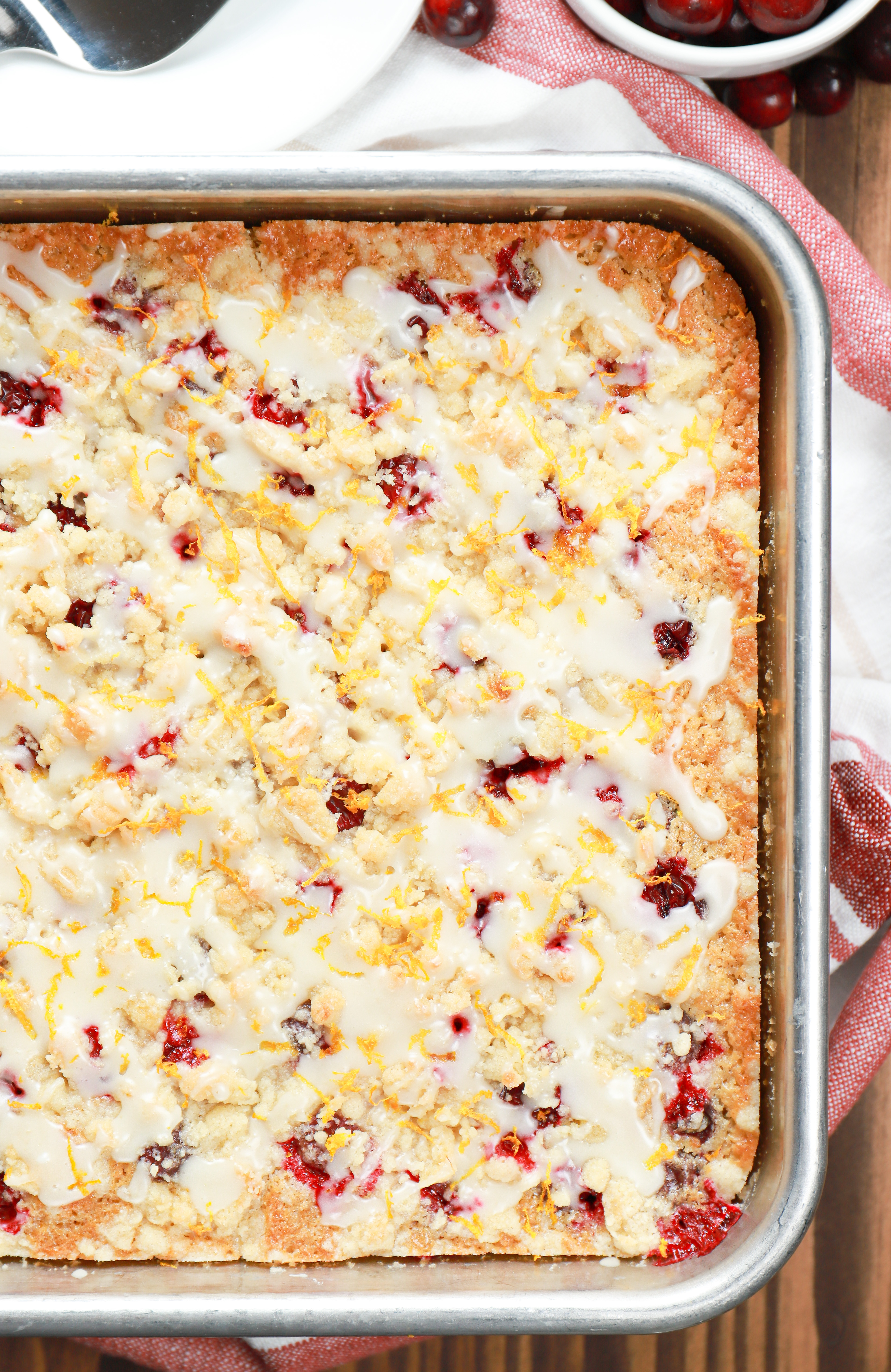 Overhead view of a cranberry orange coffee cake in an aluminum baking dish