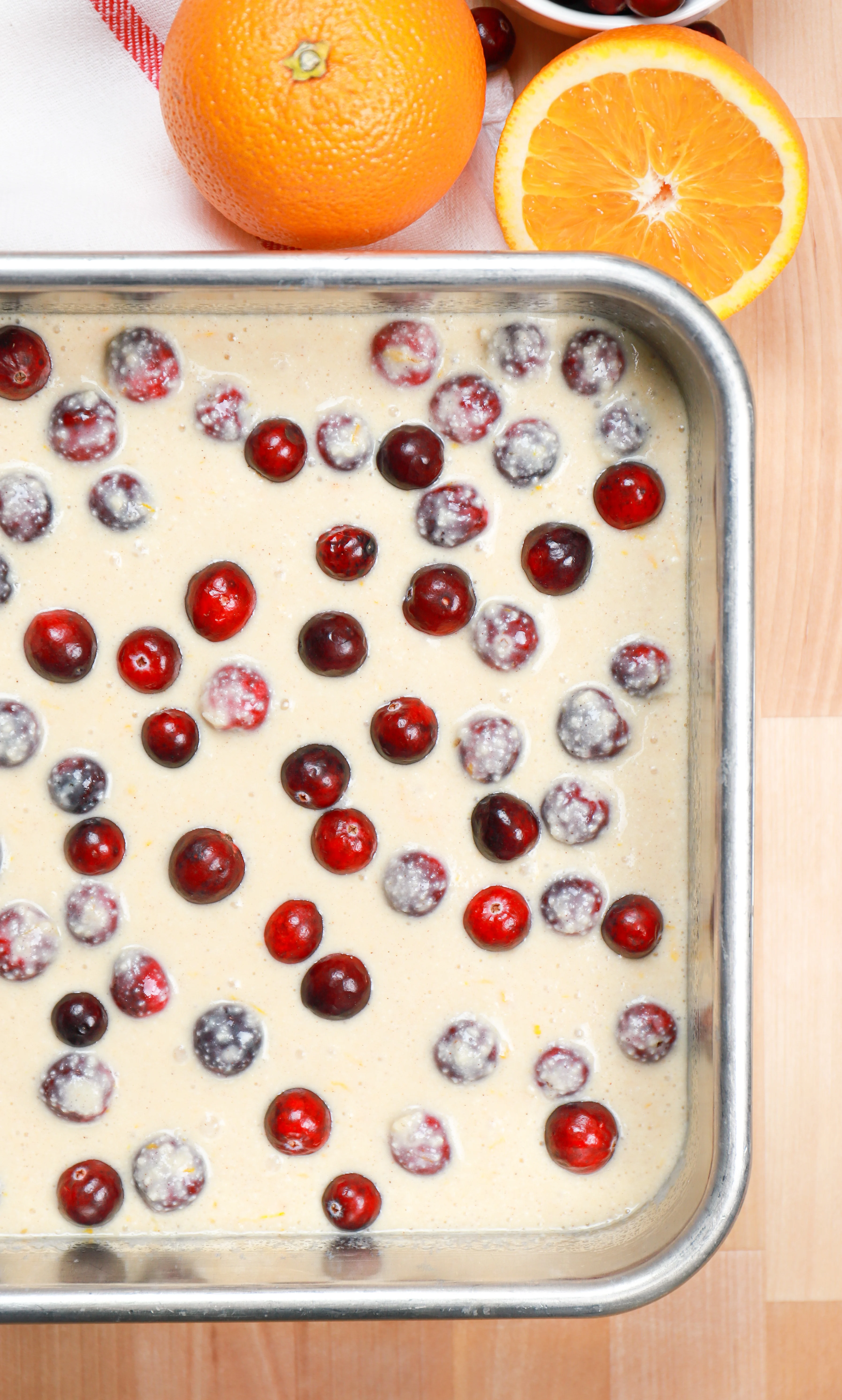 cranberry orange coffee cake batter in aluminum baking dish