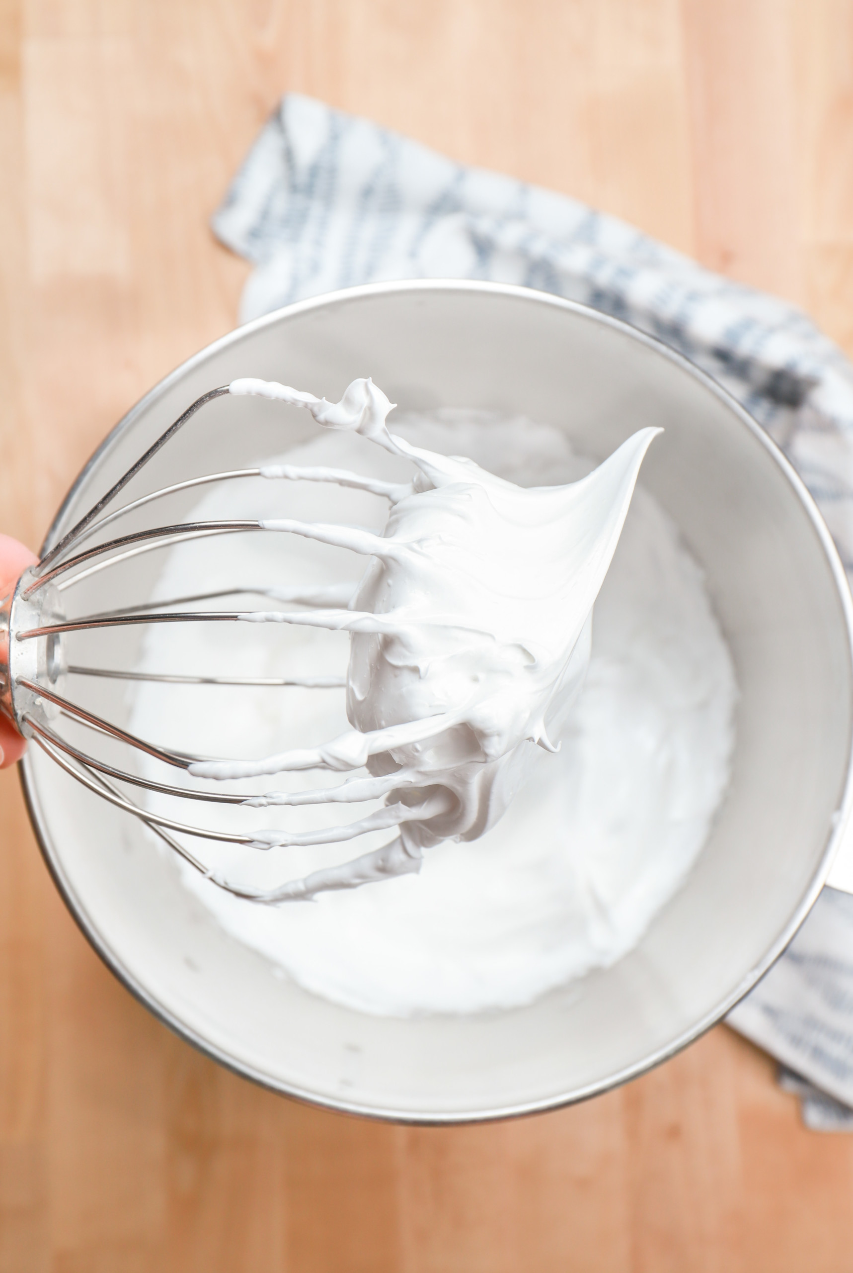 Whisk attachment showing stiff peaks of meringue.