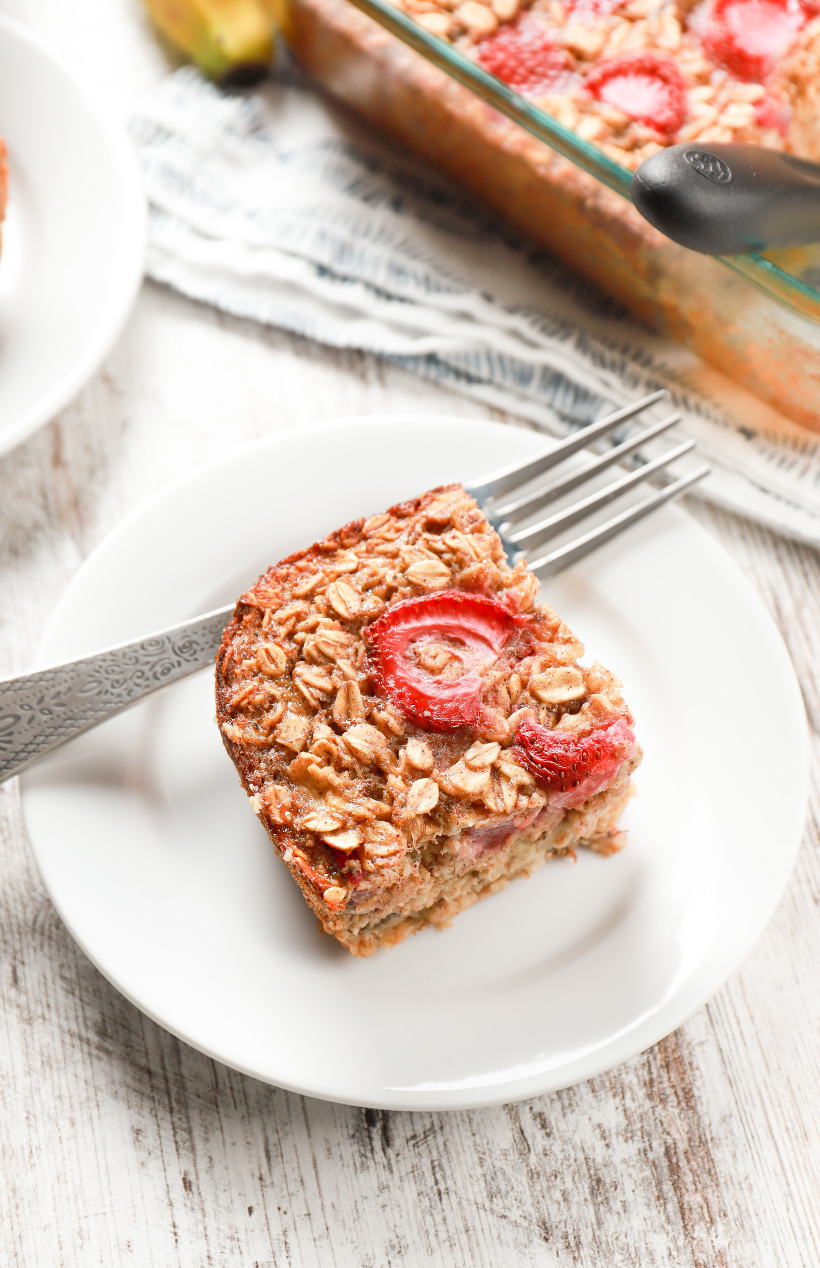 Up close overhead view of a slice of strawberry banana bread baked oatmeal.
